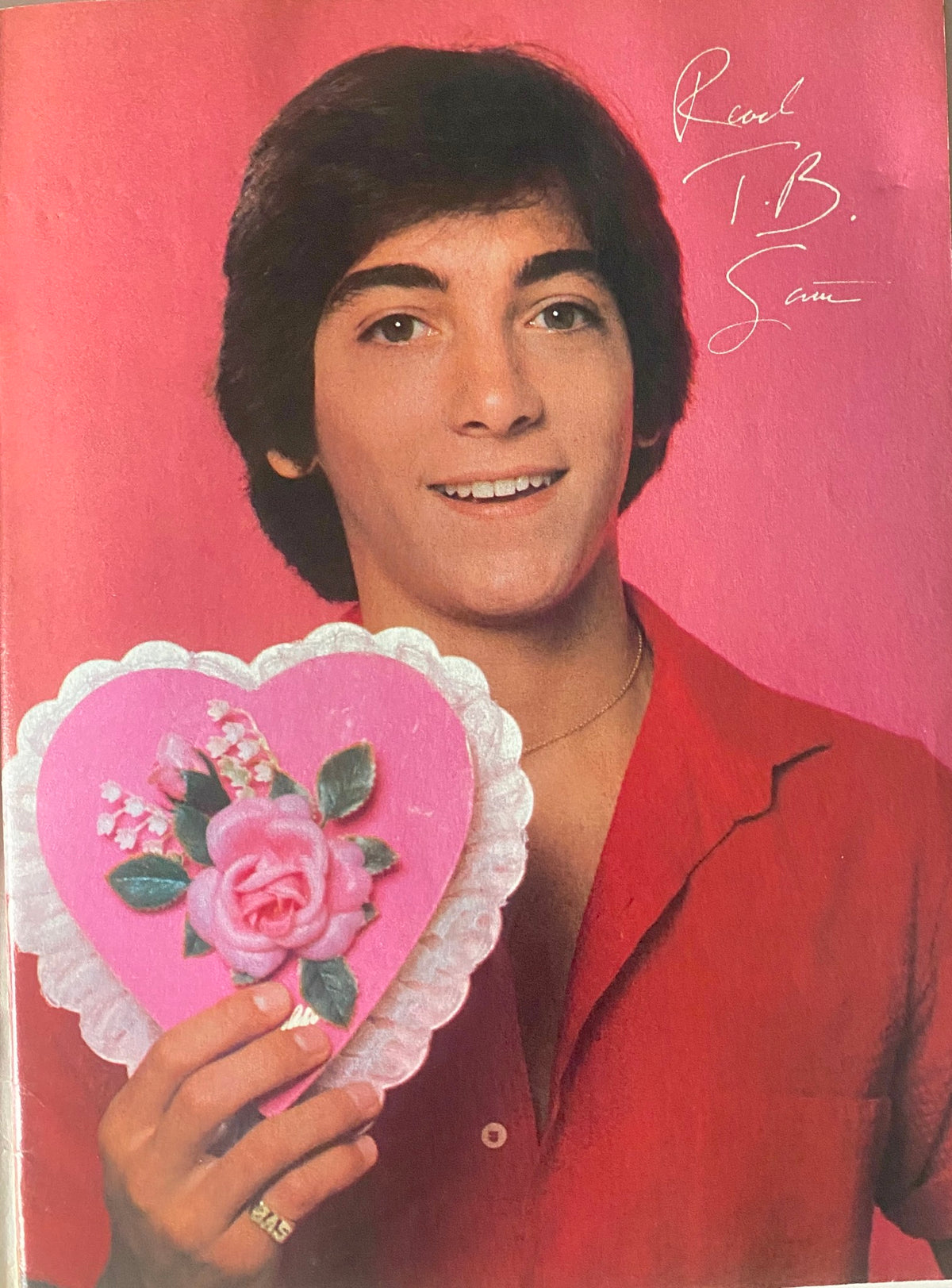 Color pin-up from Tiger Beat Magazine February 1982 featuring a young male celebrity holding a heart-shaped present.