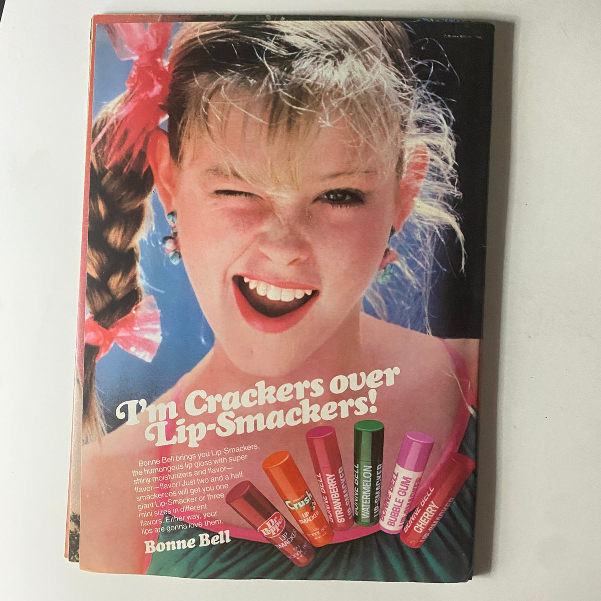 Cheerful young girl promoting Bonne Bell Lip Smackers in a vintage advertisement from Tiger Beat Star Magazine August 1982, celebrating 1980s beauty trends.