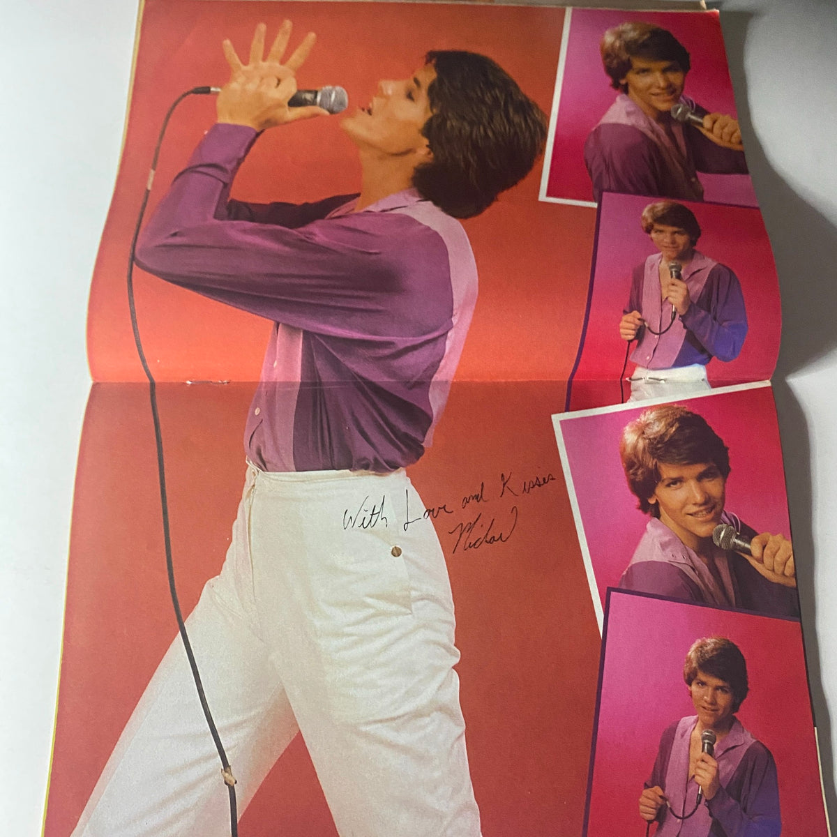 Poster inside Tiger Beat Star Magazine September 1981 showing Michael Damian performing, surrounded by additional images and his autograph.