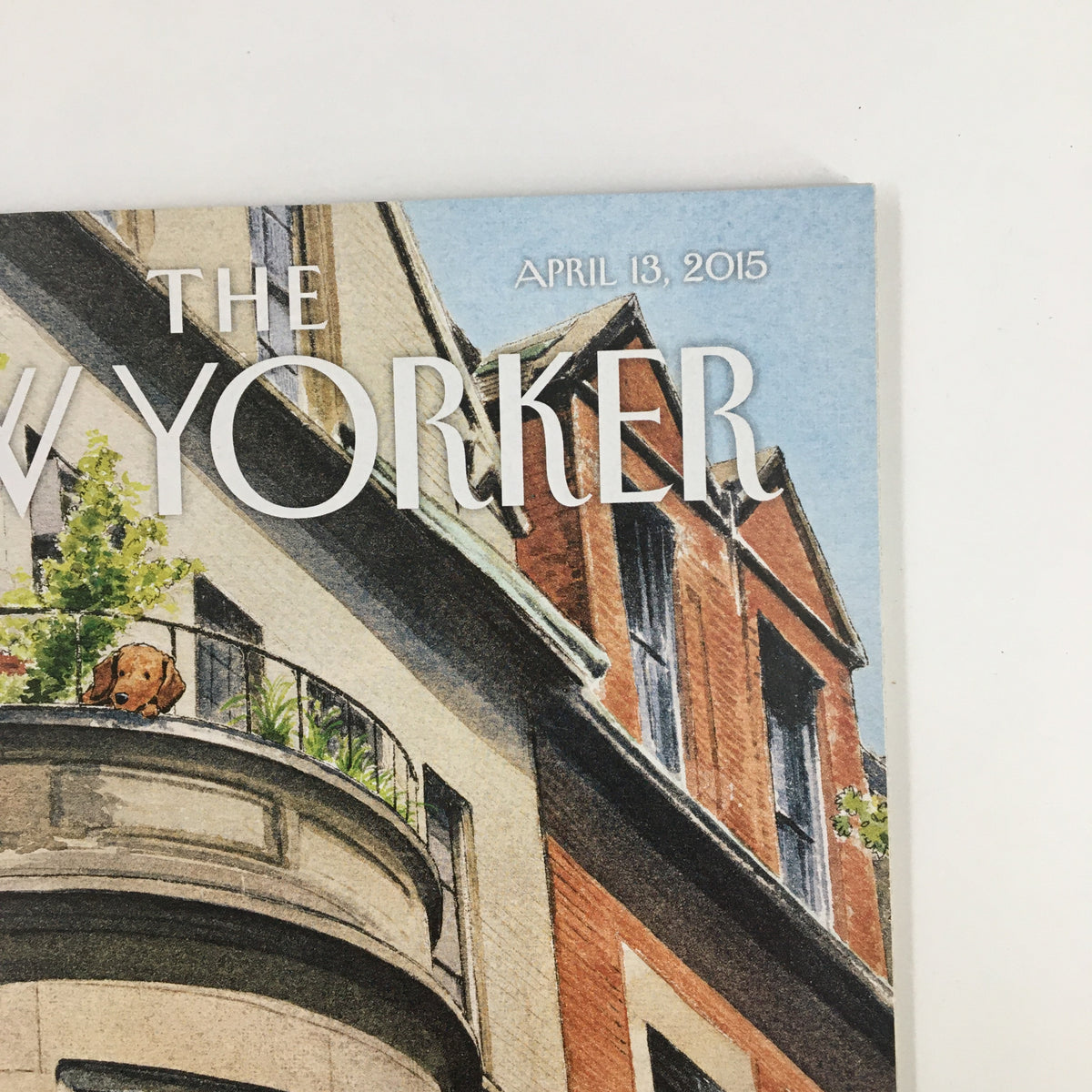 Close-up of The New Yorker Magazine cover, April 13, 2015, highlighting the balcony scene illustration by Harry Bliss, with a light blue sky and charming urban architecture.
