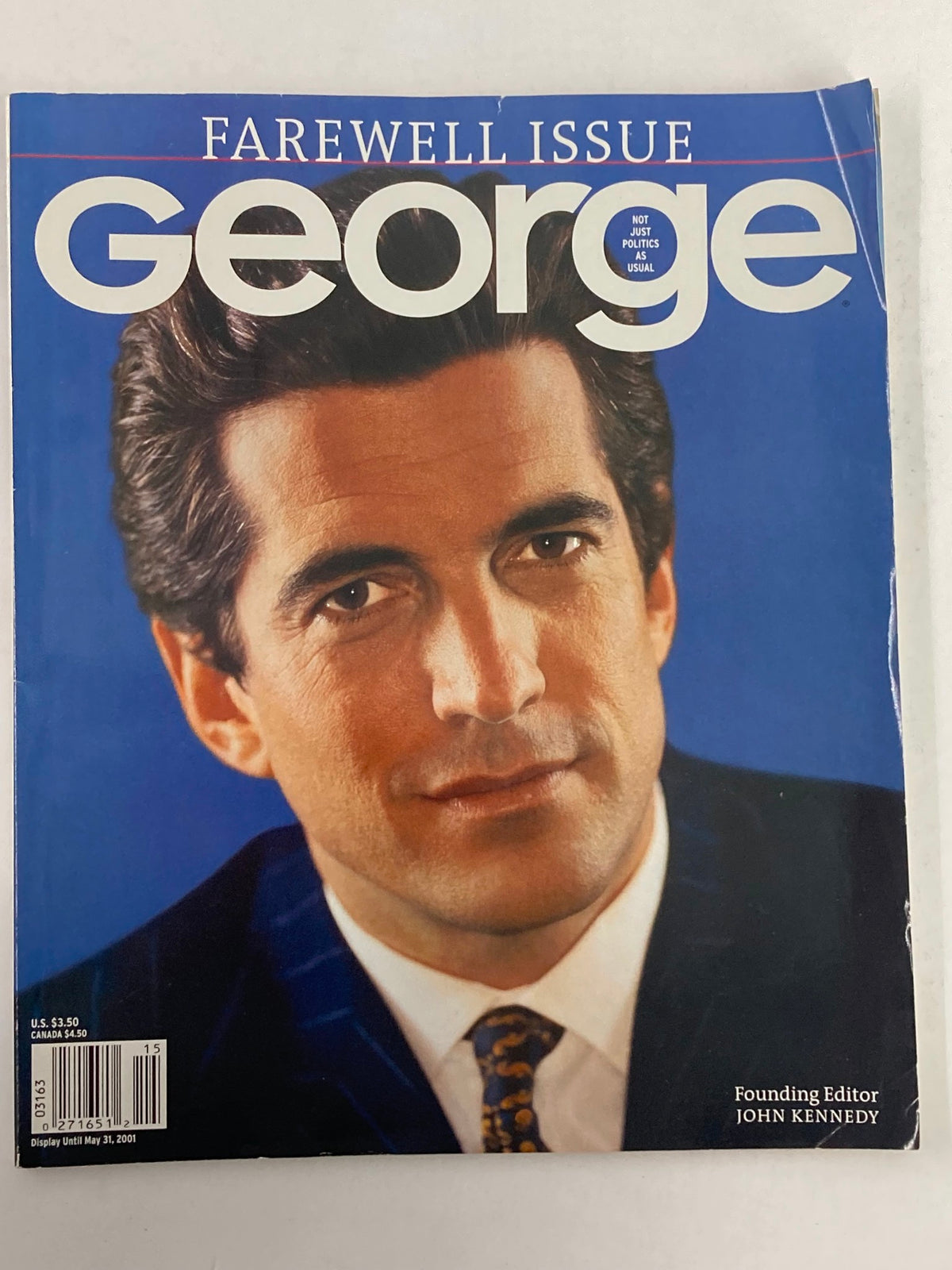 George Magazine 2001 Vol 6 #1 featuring a cover image of John F. Kennedy Jr. as the Founding Editor. This farewell issue showcases captivating photography and a distinguished portrait style.
