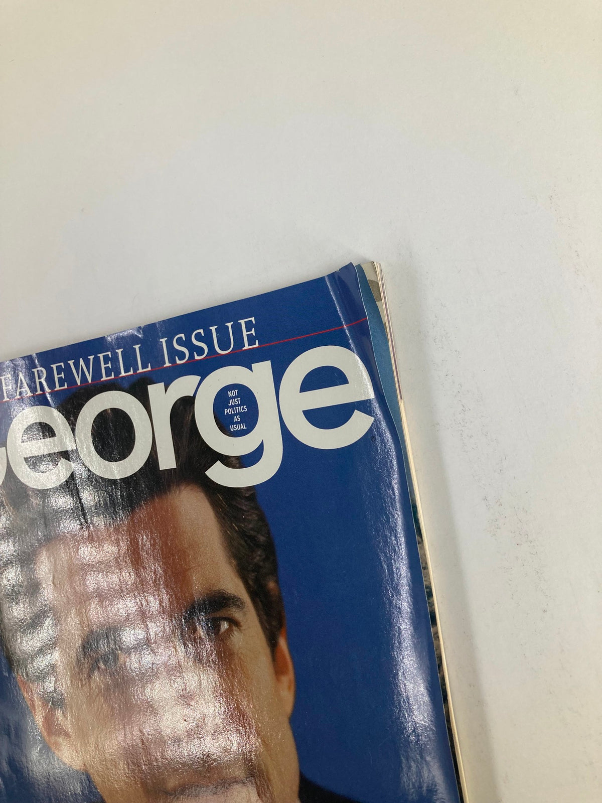 Close-up image of the cover of George Magazine 2001 Vol 6 #1, highlighting the magazine title and the face of John F. Kennedy Jr, the Founding Editor, with a farewell issue label.