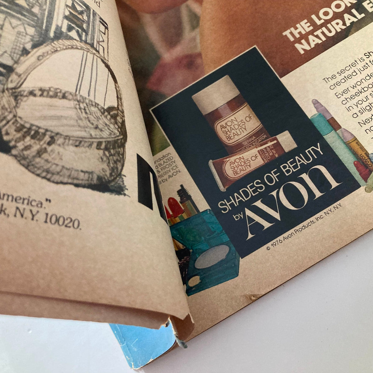 Interior page of VTG Ebony Magazine July 1976 displaying an advertising section for Avon beauty products, highlighting 'Shades of Beauty' with colorful products.