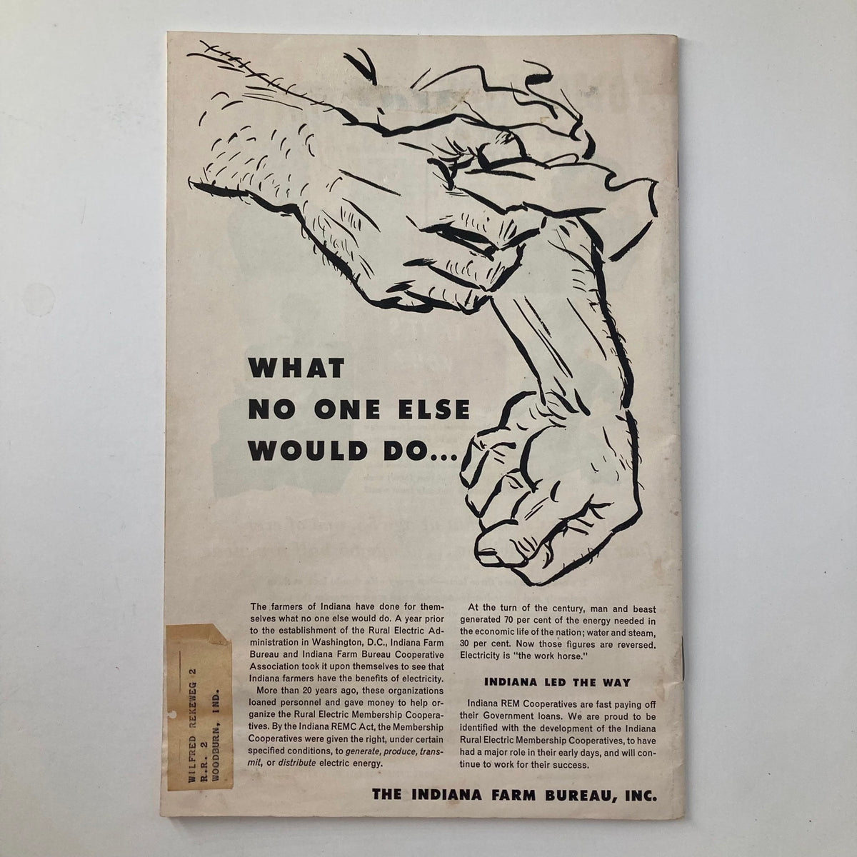 Back cover of VTG The Hoosier Farmer Magazine July 1957, displaying an illustration of hands gripping a shovel with text about the role of Indiana farmers in electricity generation.