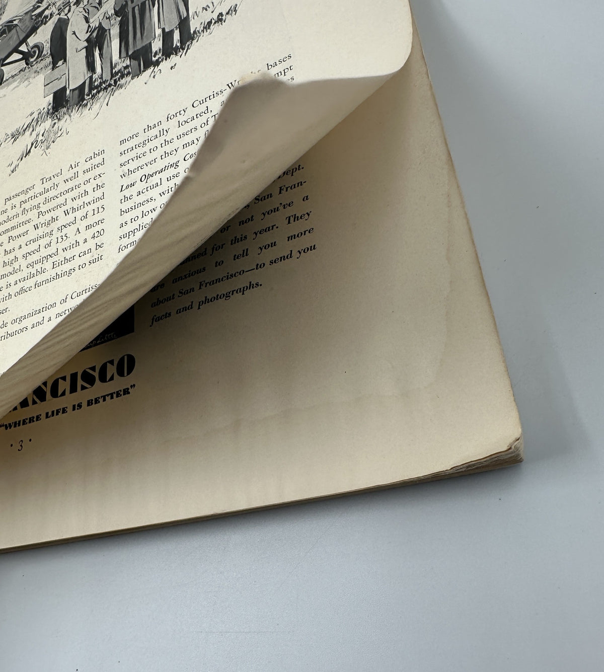 Close-up view of the corner of a vintage Fortune Magazine from March 1930, showing significant wear, including a bent page corner and discoloration, highlighting its historical condition.