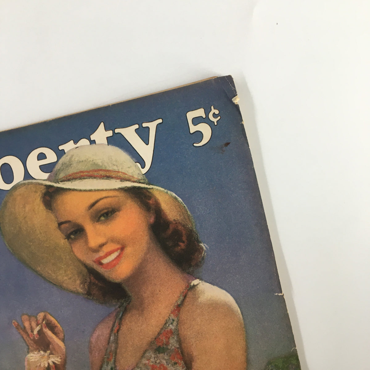 VTG Liberty Magazine May 11 1940 cover featuring a smiling woman in a hat, a nostalgic illustration emblematic of vintage publications.