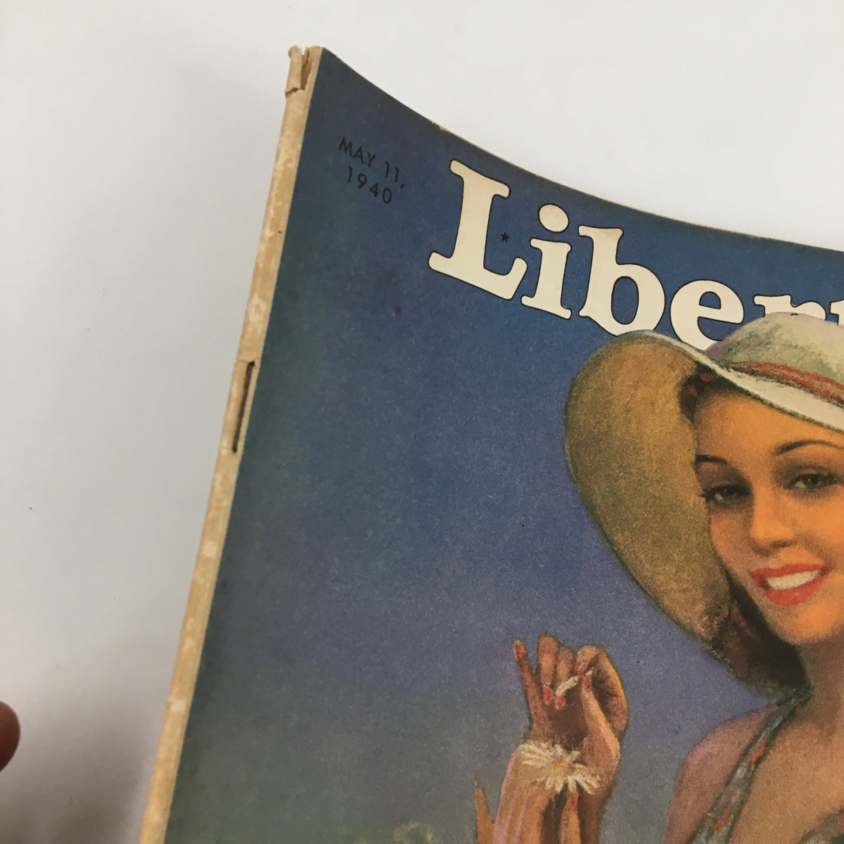 Close-up shot of the VTG Liberty Magazine May 11 1940 cover, highlighting the date and details of the magazine's design.