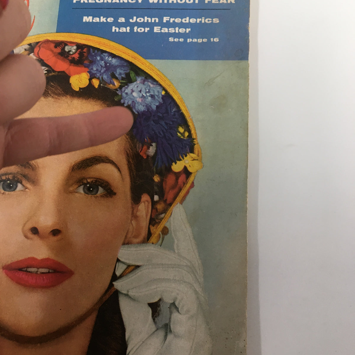 Detailed view of the cover of VTG Family Circle Magazine March 1956 showing a woman in a hat, with text about Easter hat making.