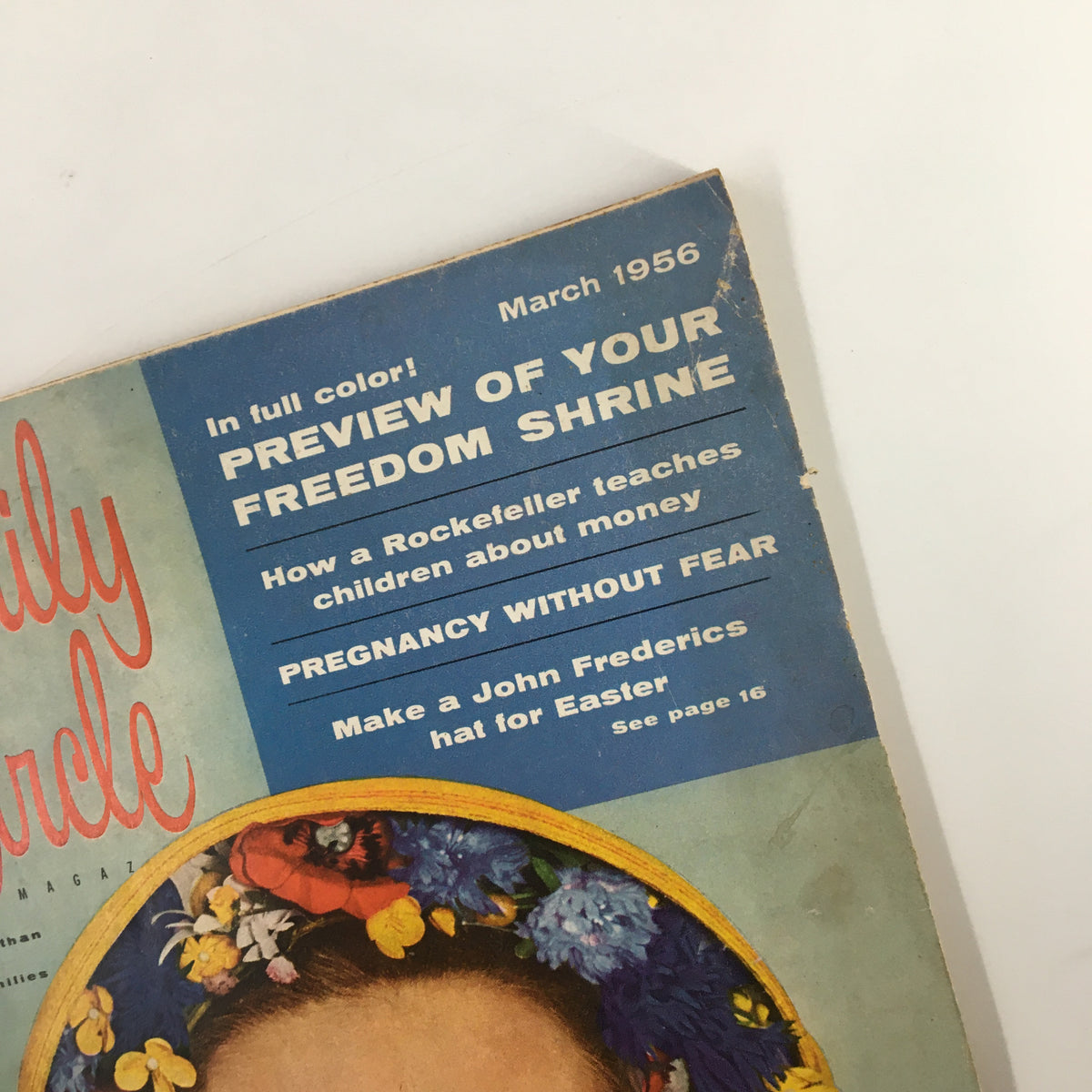 Top section of VTG Family Circle Magazine March 1956 cover, featuring text about fashion and articles, surrounded by floral design.