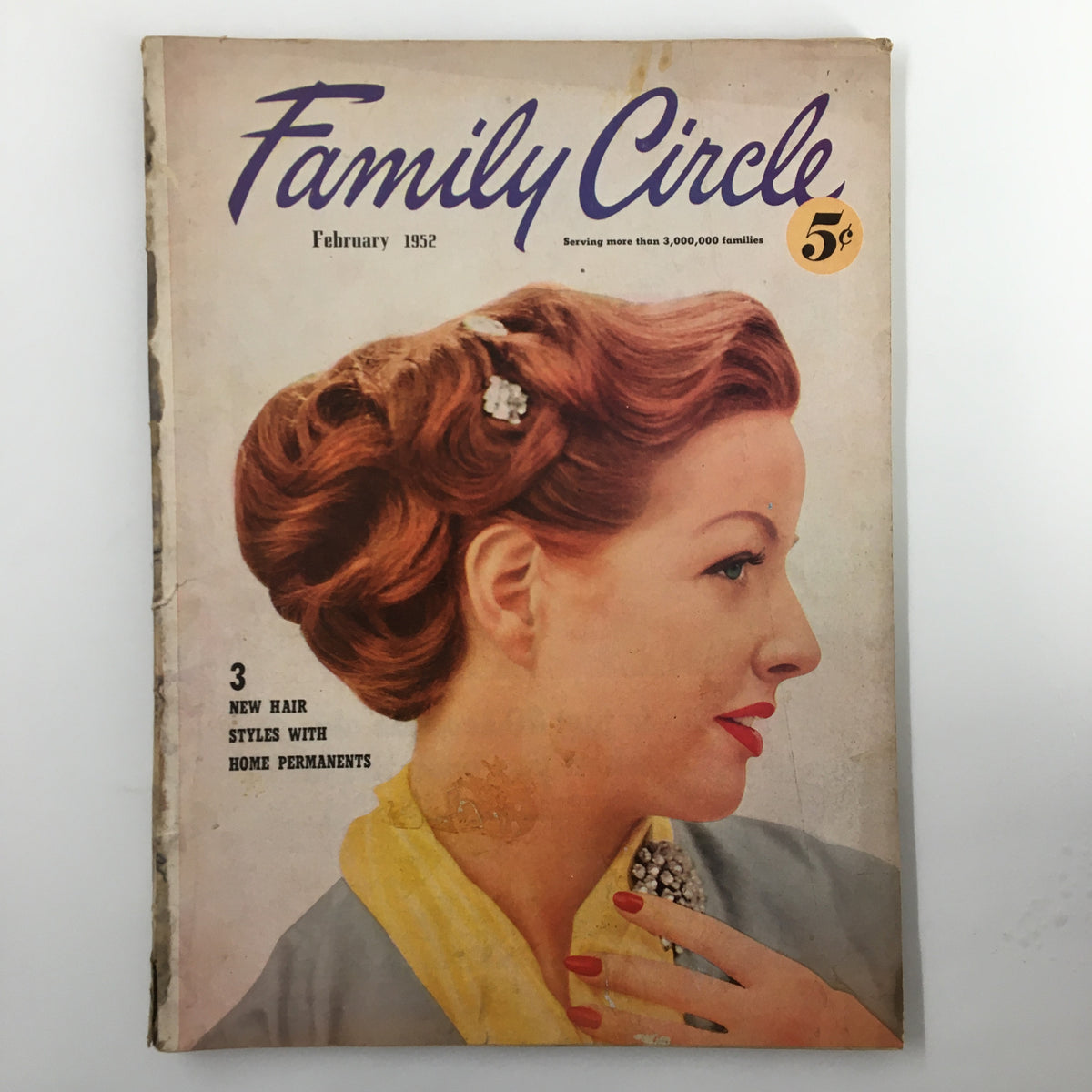 Cover of VTG Family Circle Magazine February 1952 featuring a woman with elegant hairstyle, showcasing vintage aesthetic and style.
