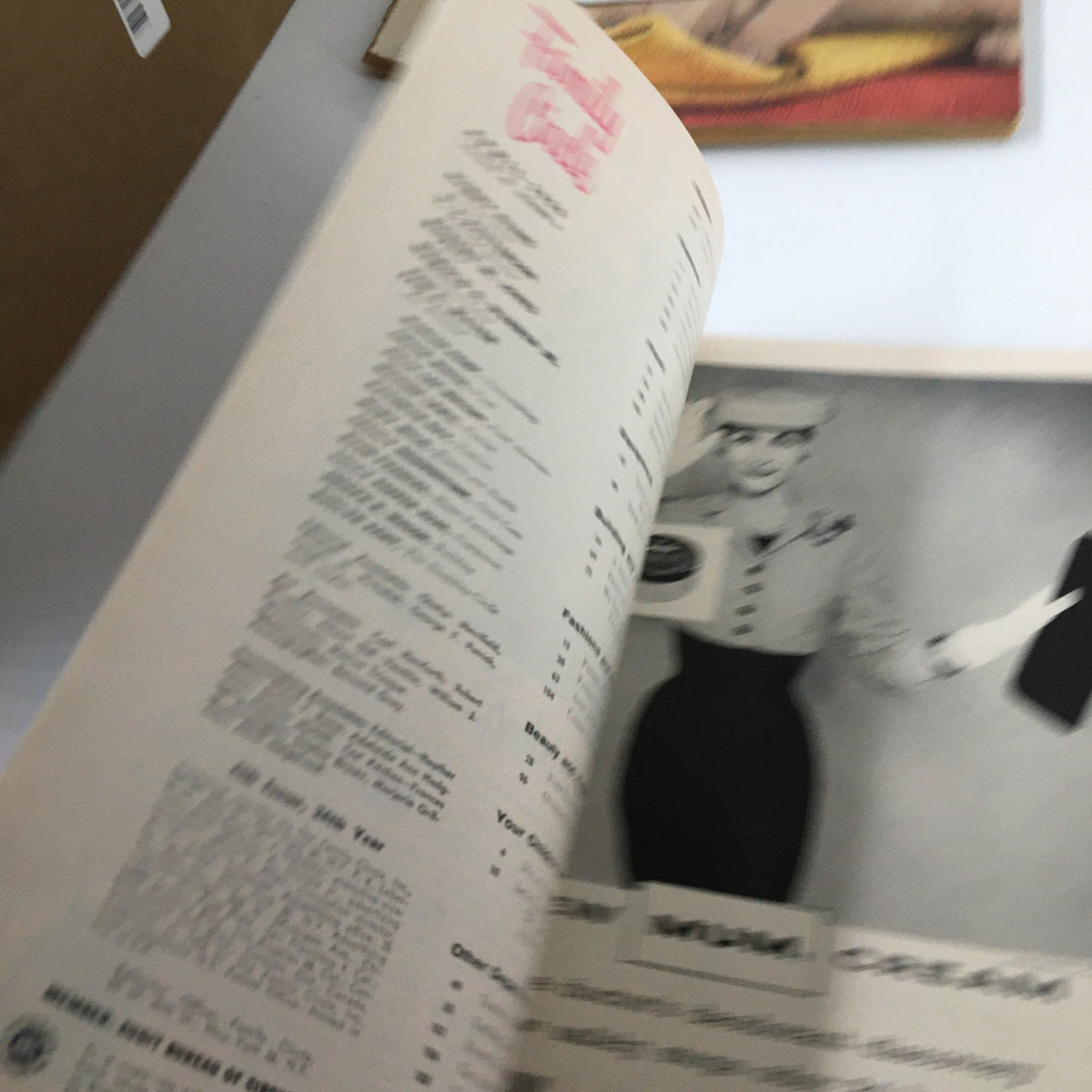 Inside page of the VTG Family Circle Magazine April 1956, displaying a vintage advertisement with a woman in a stylish outfit and text promoting various recipes.