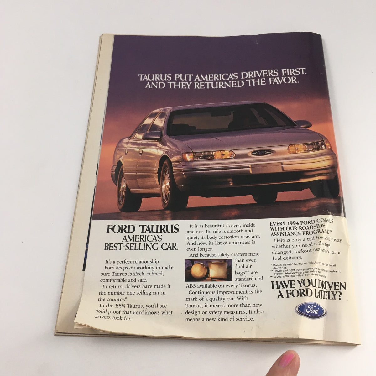 Interior page of Time Magazine February 21, 1994, featuring an advertisement for Ford Taurus, America's best-selling car.