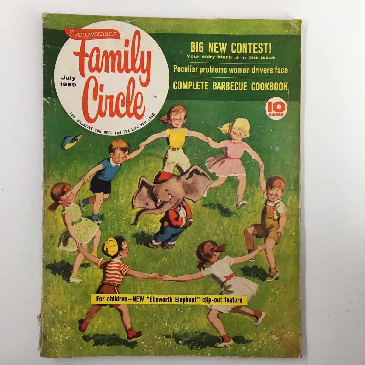 Cover of VTG Family Circle Magazine July 1959 featuring children playing with Ellsworth Elephant in a colorful outdoor setting, highlighting mid-20th century family life.