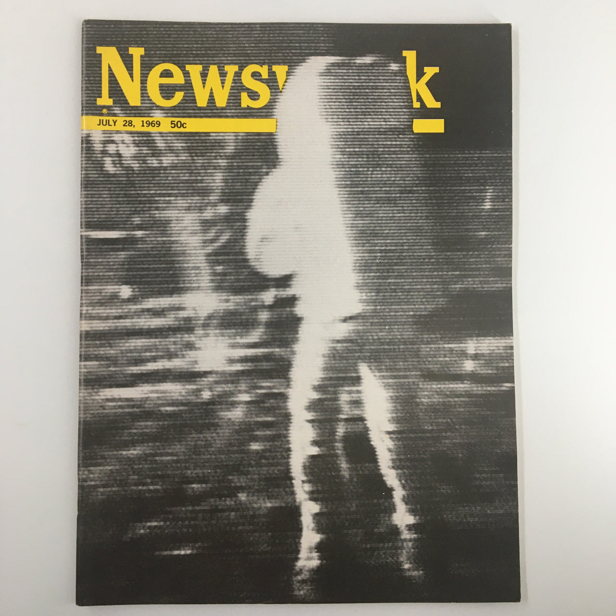 VTG Newsweek Magazine July 28 1969 featuring a blurry photo from the Moon, showcasing the historic moment of the lunar landing. The magazine is in good condition with minor wear and comes with a plastic protective covering.
