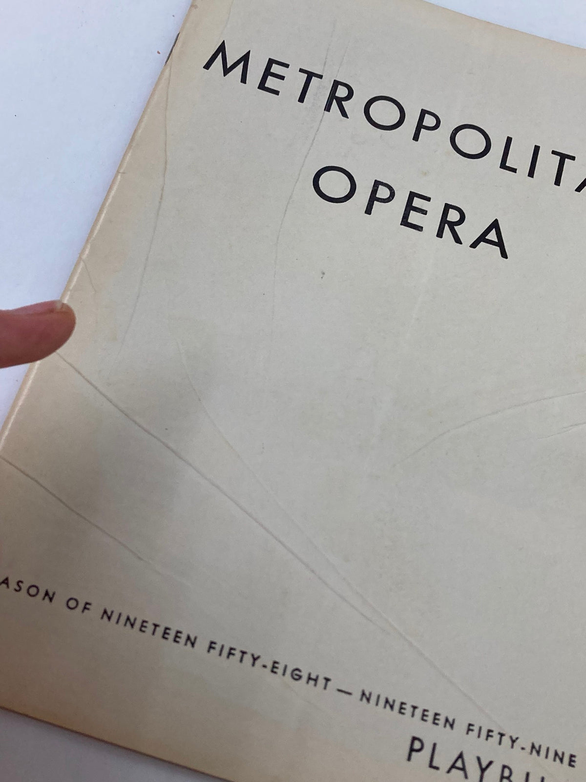 Close-up view of the 1959 Playbill from the Metropolitan Opera Season 1958-1959 showing wear and detailing on the cover.