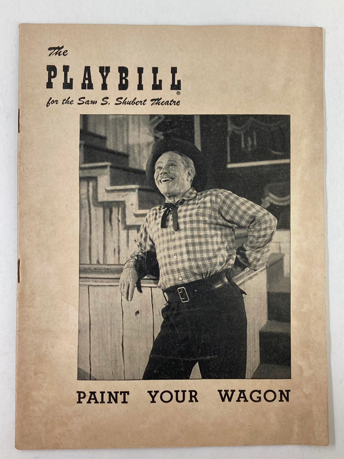 Front cover of the 1952 Playbill for the Sam S. Shubert Theatre featuring James Barton in Paint Your Wagon, showcasing a vintage design with an actor smiling in costume.