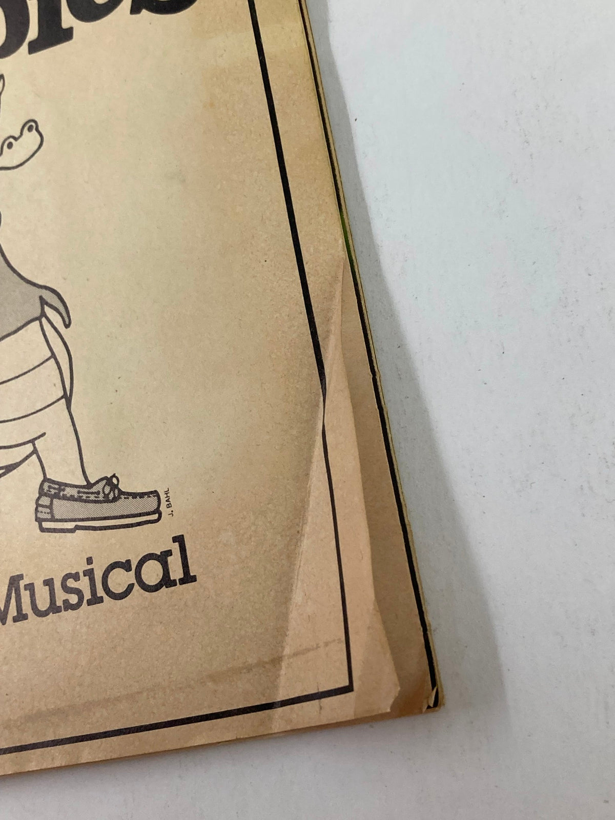 Close-up of the 1983 Showbill for Preppies showcasing the playful crocodile character on the cover, highlighting its vintage design and significance in theatrical history.