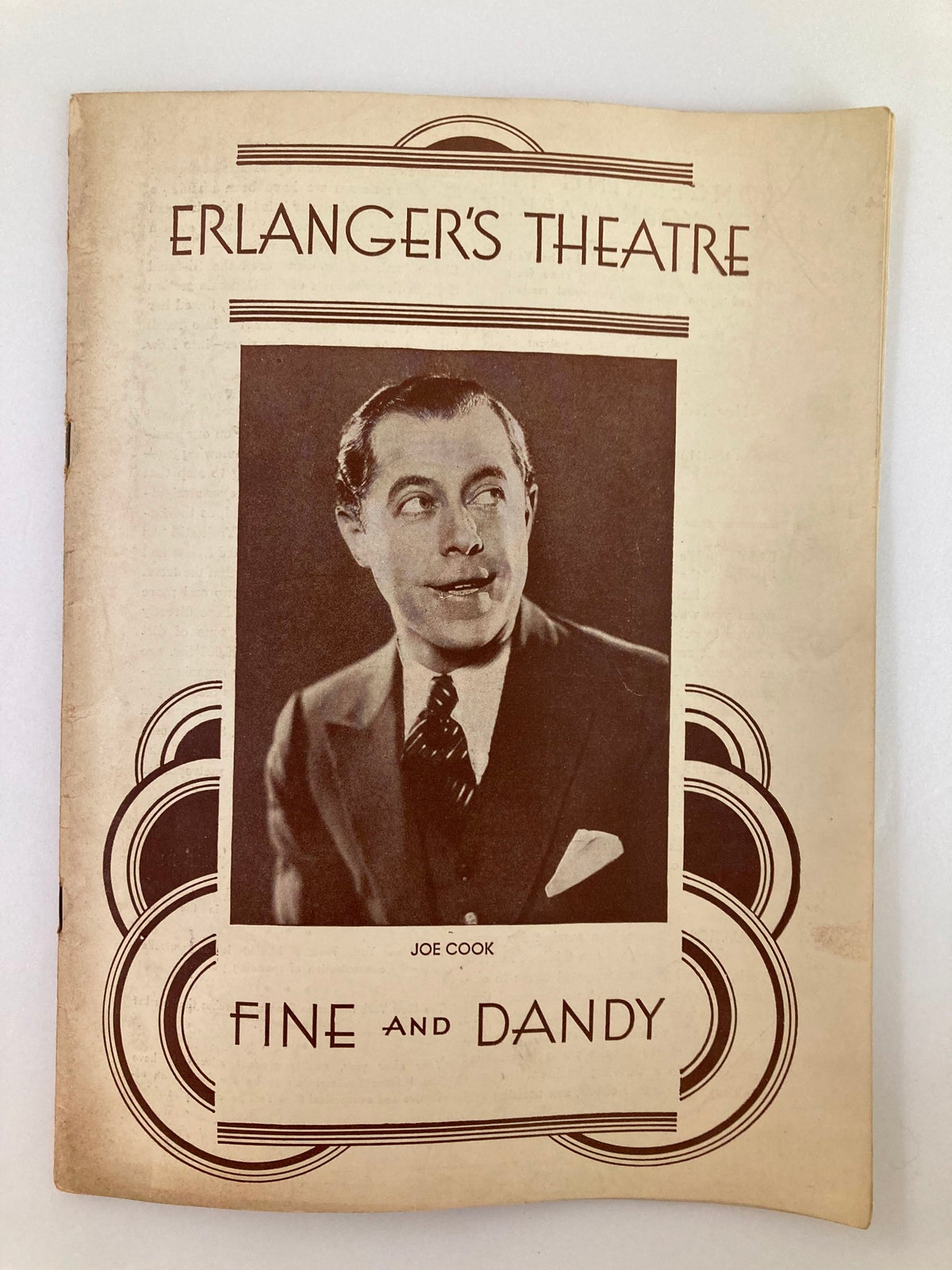 Cover of the 1930 program from Erlanger's Theatre featuring Joe Cook in 'Fine and Dandy.' Vintage design showcasing classic theatrical style.