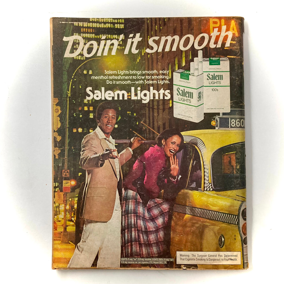 Ebony Magazine April 1981 advertisement for Salem Lights, illustrating a stylish couple promoting the smooth menthol cigarettes in a vibrant city night backdrop.