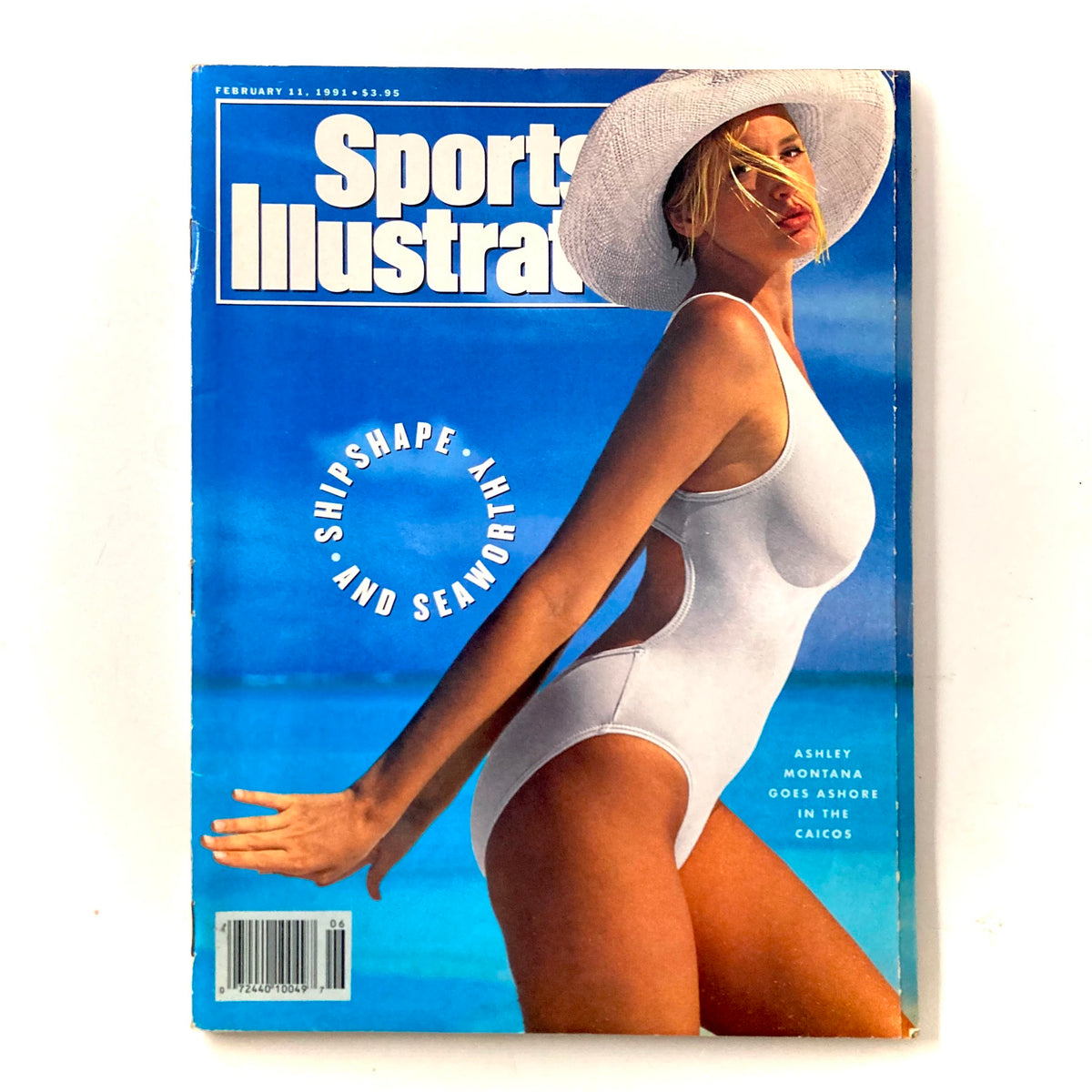 Cover of Sports Illustrated Magazine February 11 1991 featuring Ashley Montana in a swimsuit against a backdrop of the Caicos Islands.