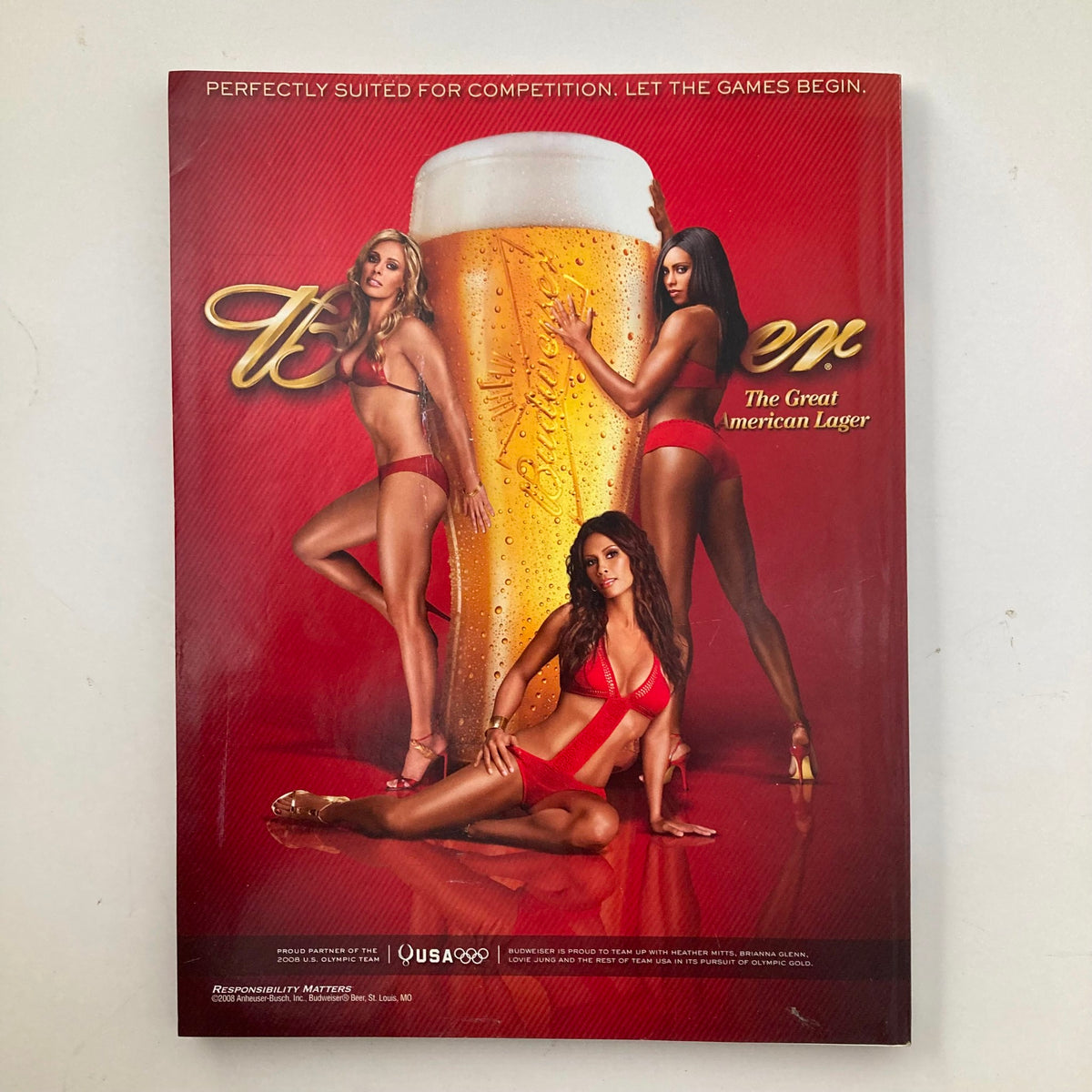 Back cover of Sports Illustrated Magazine Winter 2008 featuring a promotional image of models in red swimsuits for a beer brand.