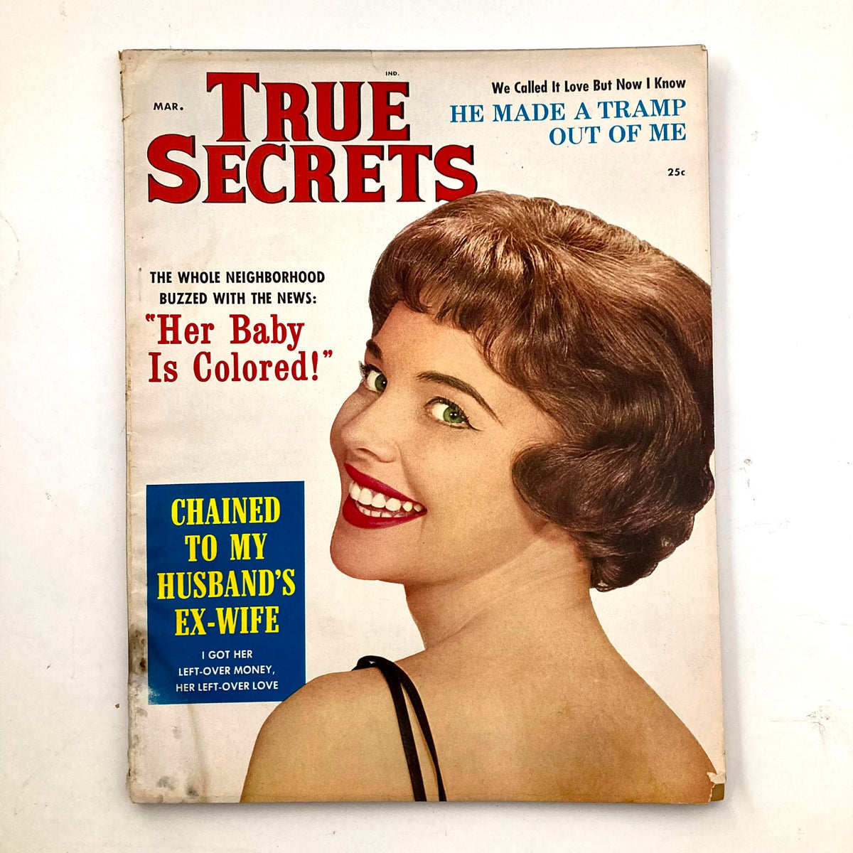 Cover of the VTG True Secrets Magazine March 1960 featuring the headline 'He Made A Tramp Out of Me' and an illustration of a smiling woman with black short hair.