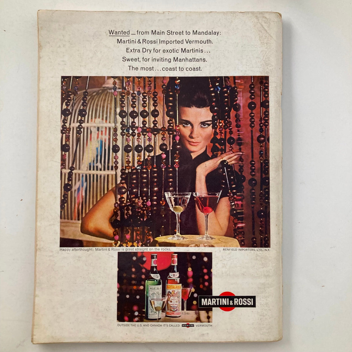 Back cover of VTG Playboy Magazine September 1966 featuring an advertisement for Martini & Rossi, complete with an elegant model and vintage styling.
