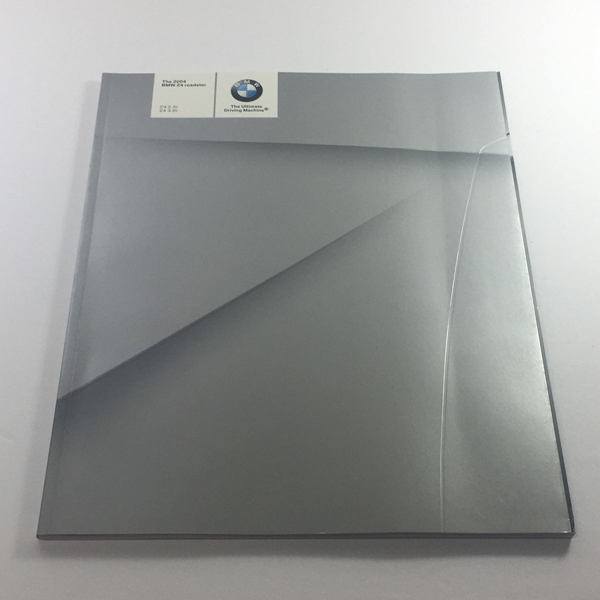 Cover of the 2004 BMW Z4 Roadster 2.5i 3.0i Dealership Car Auto Brochure, featuring a sleek gray design.