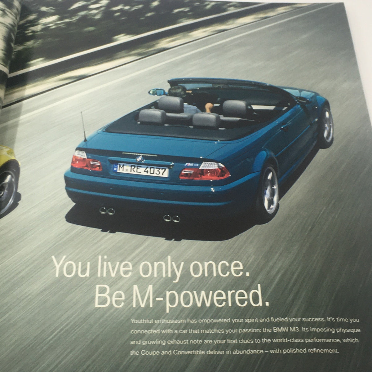 2004 BMW M3 Coupe - Convertible Dealership Car Auto Brochure Catalog showcasing a blue convertible cruising on a road, emphasizing the dynamic design of the BMW M3.