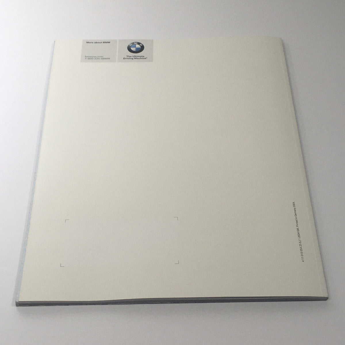 2004 BMW M3 Coupe - Convertible Dealership Car Auto Brochure Catalog featuring the back cover of the brochure, displaying the BMW logo and a clean design background.