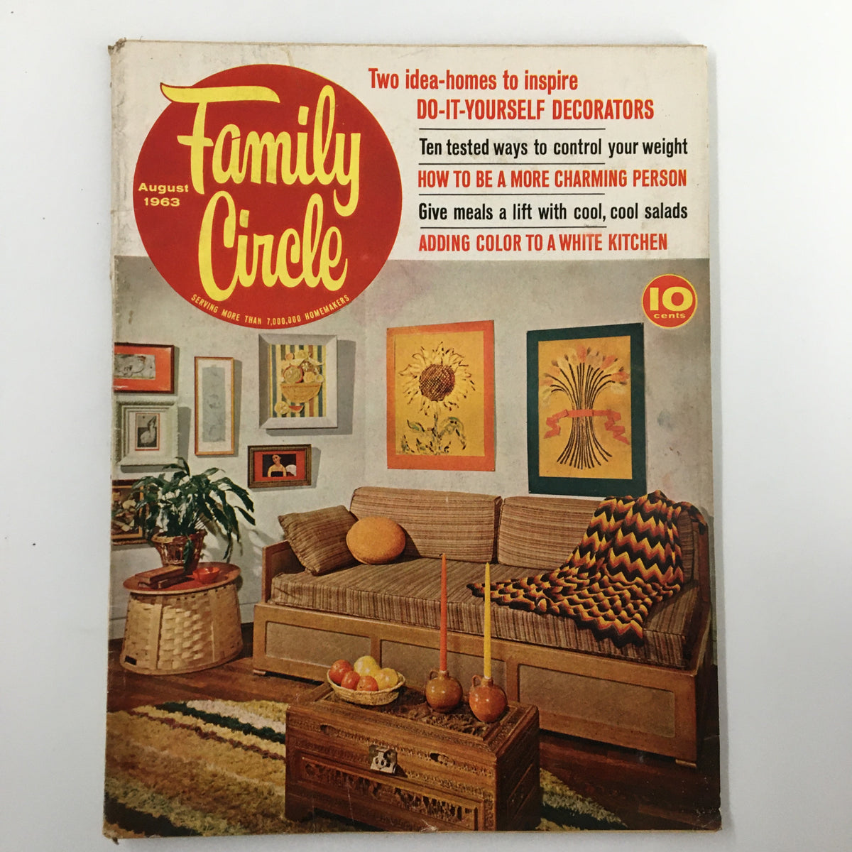Vintage Family Circle Magazine from August 1963 showcasing two inspiring idea-homes, do-it-yourself decor tips, and practical advice on weight control and charming personality. Featuring a cozy living room scene with artistic wall decor and a rustic coffee table.