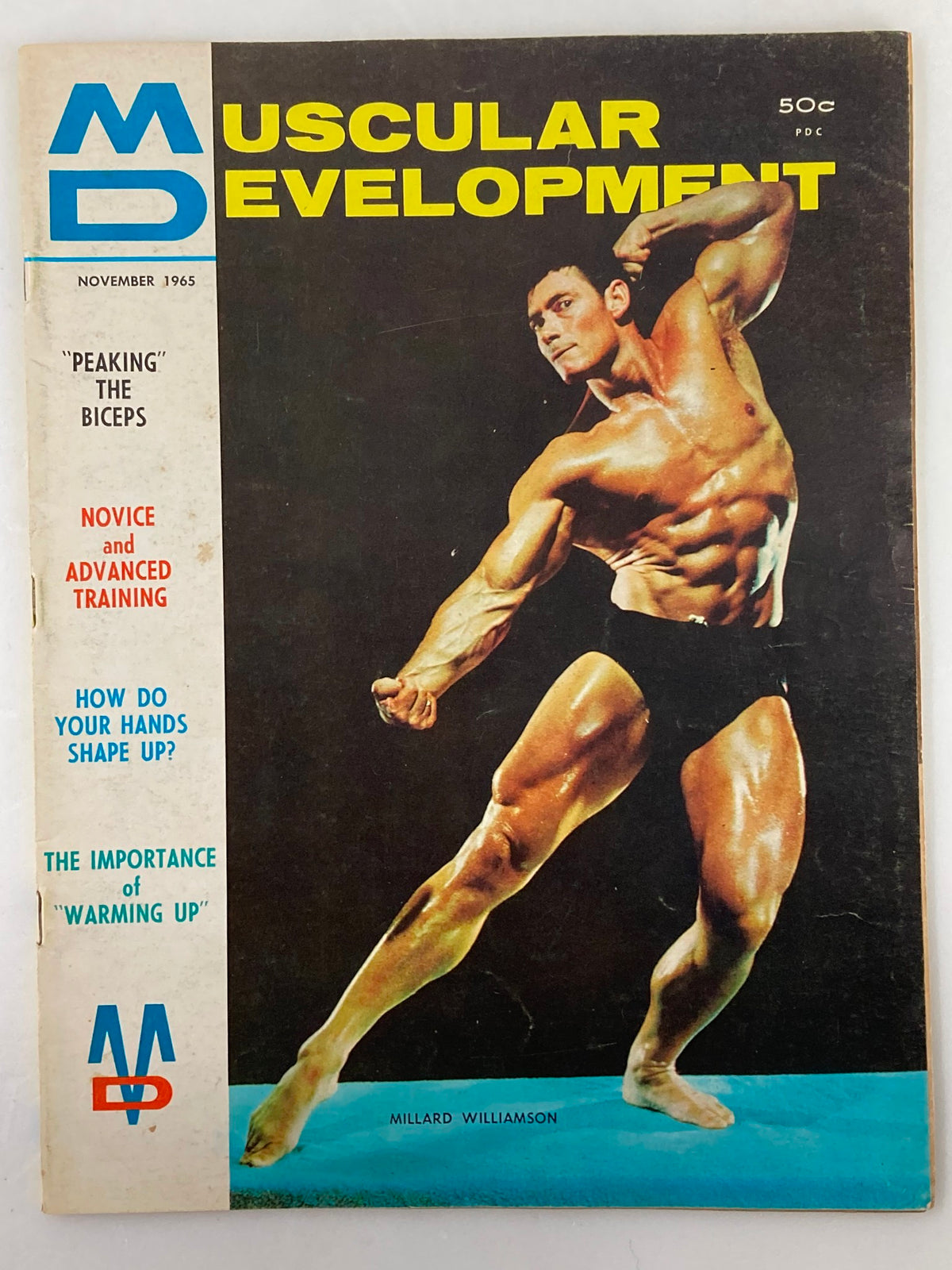 VTG Muscular Development Magazine November 1965 cover featuring Millard Williamson showcasing impressive biceps, with colorful graphics highlighting fitness topics.