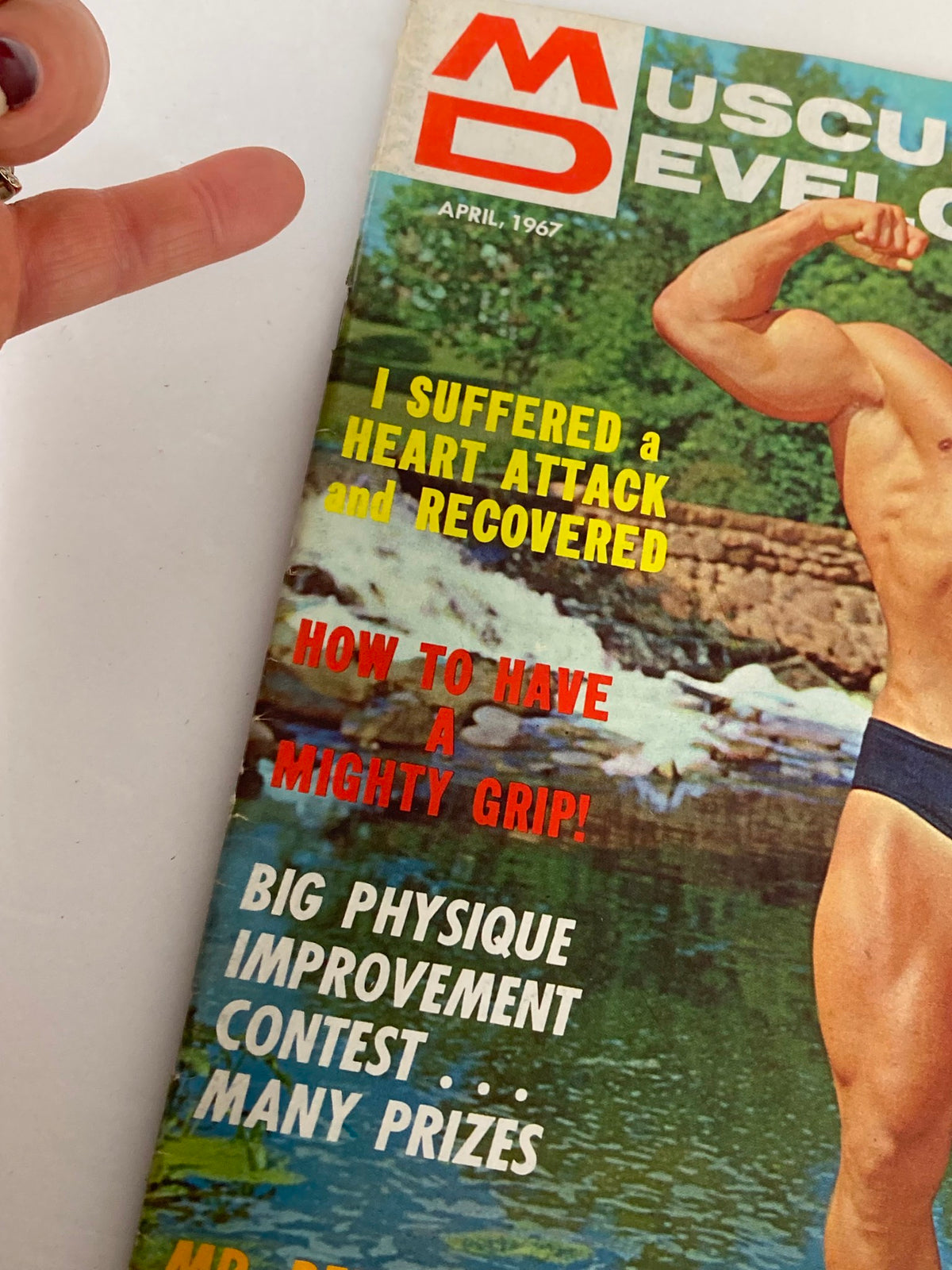 Close-up of the cover text from VTG Muscular Development Magazine April 1967 Vol 4 #4 highlighting articles on fitness and bodybuilding.