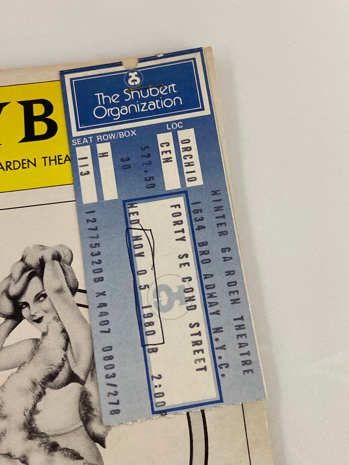 Close-up of the ticket stapled to the 1980 Playbill from Winter Garden Theatre for 42nd Street, featuring details like seat information and date.