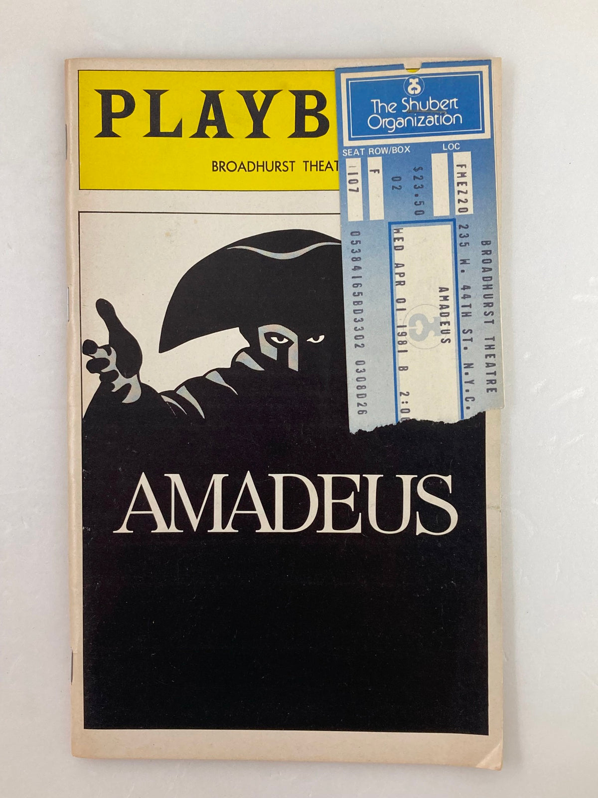 1981 Playbill for Amadeus at Broadhurst Theater featuring iconic cover design and attached ticket stub. Good condition with minor wear. A collectible item celebrating the performances of Ian McKellen and Tim Curry.