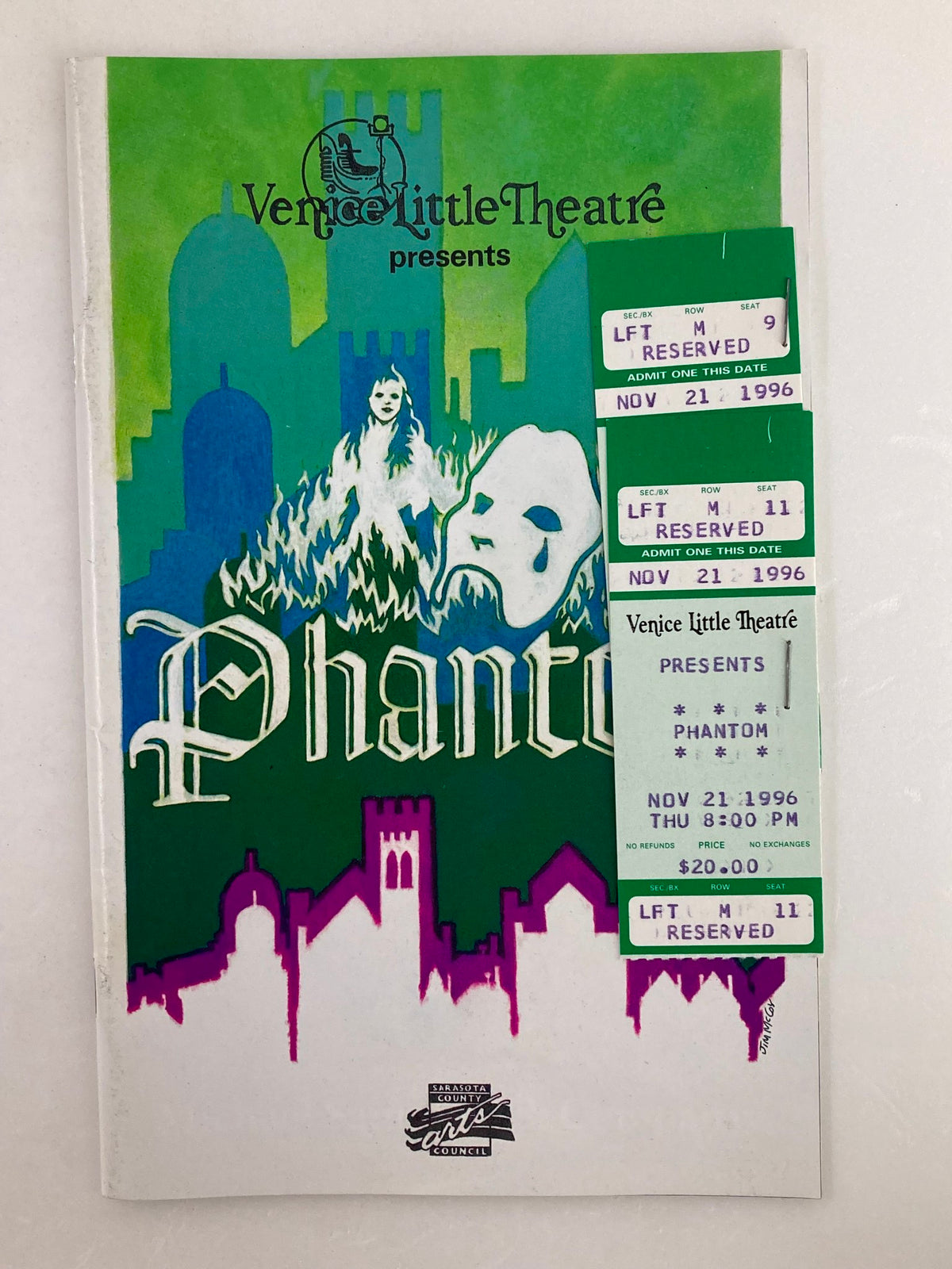 1996 Souvenir Program for Venice Little Theatre's Phantom production featuring a colorful cover with theatrical elements and ticket stubs affixed to the front.