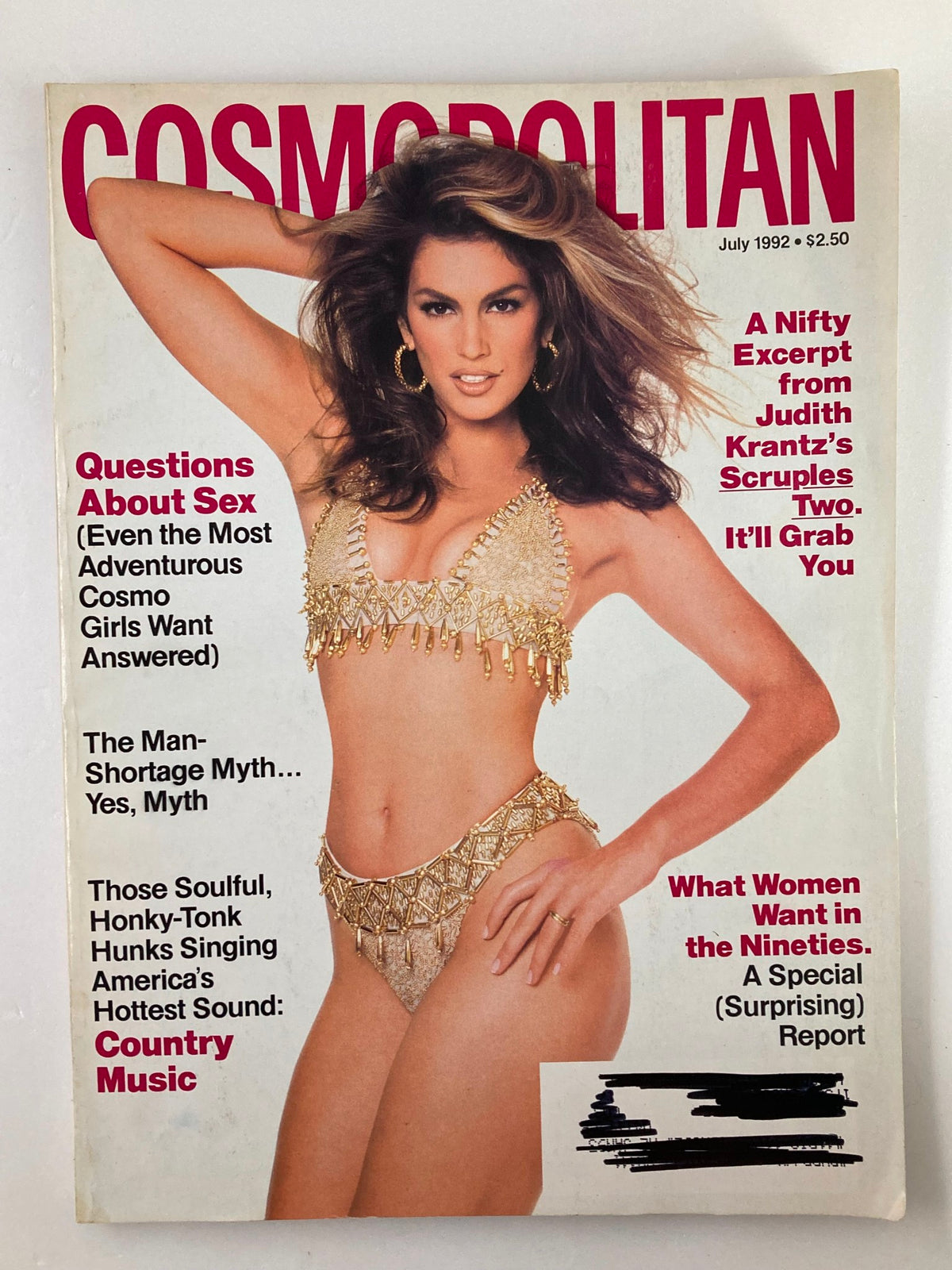 Cover of VTG Cosmopolitan Magazine July 1992 featuring Judith Krantz's Scruples Two, showcasing a model in a gold bikini with bold text highlighting various articles and enticing readers to explore the content.