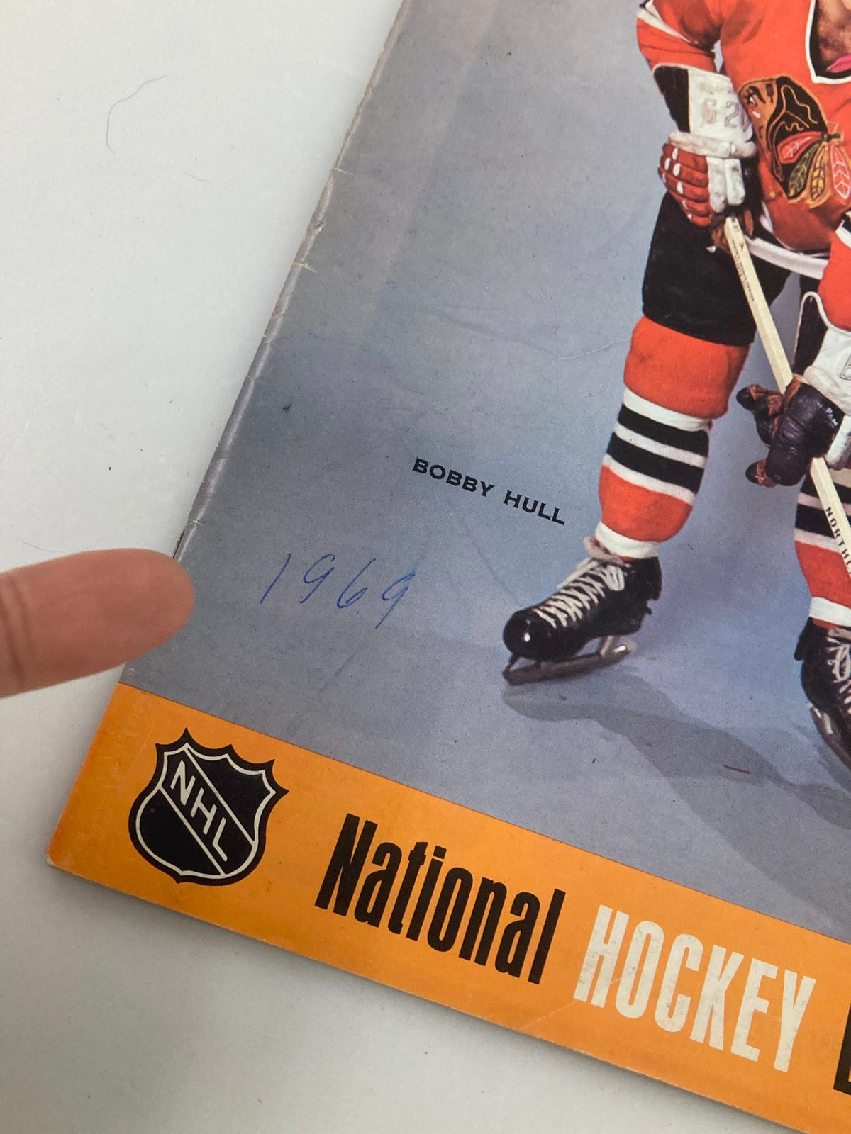 Close-up of the 1969 NHL Bobby Hull Philadelphia Flyers vs Chicago Black Hawks Vol 2 #29 magazine highlighting the year '1969' handwritten on the cover near Bobby Hull's image.