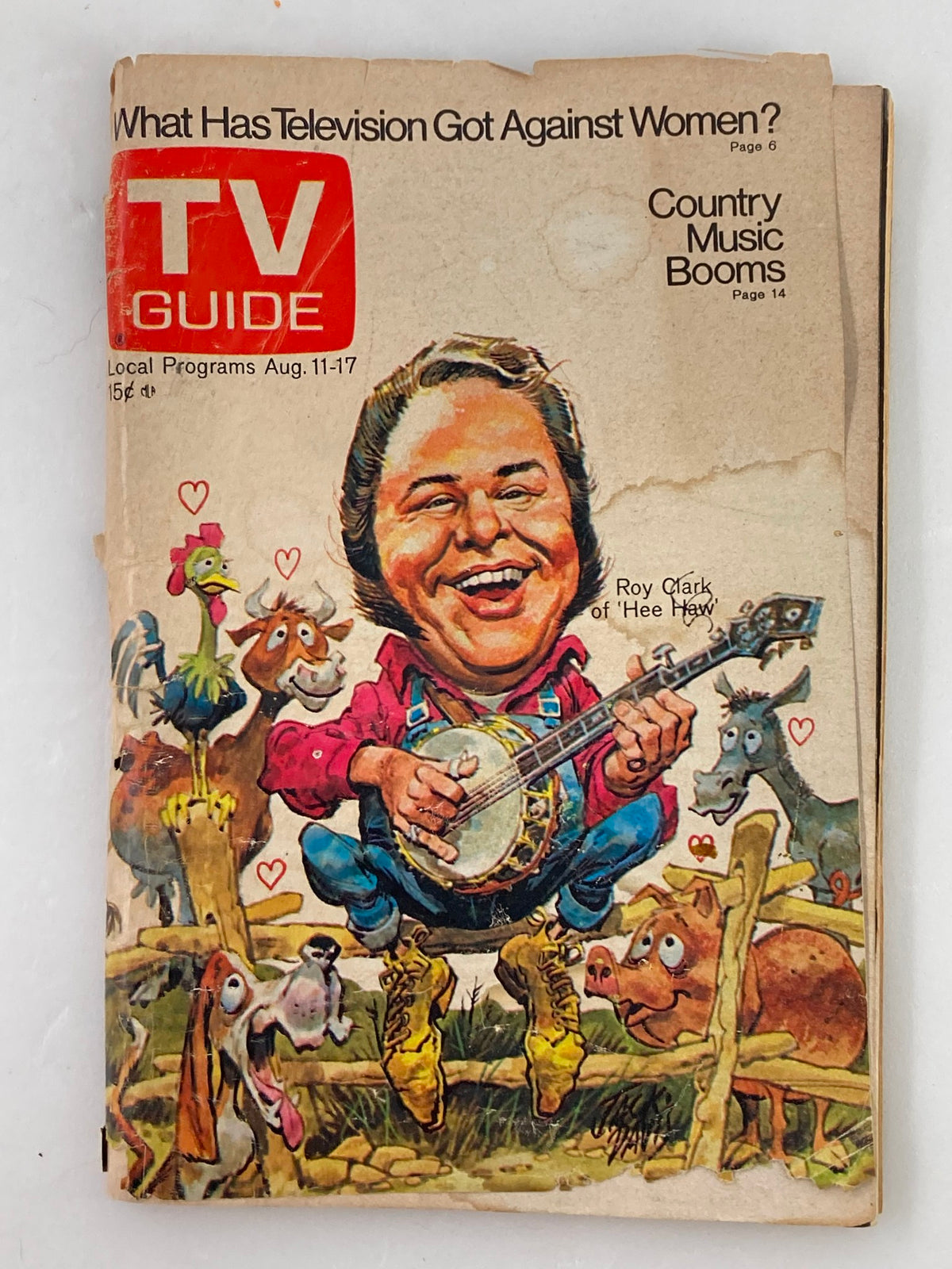 Cover of TV Guide Magazine August 11 1973 #563 featuring a colorful illustration of Roy Clark surrounded by animals, showcasing a playful cartoon style, with the title 'What Has Television Got Against Women?' and references to country music.