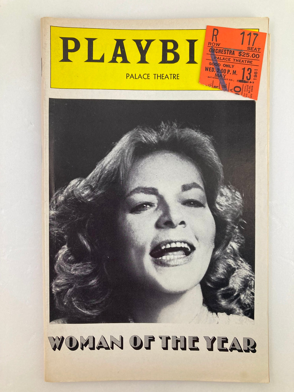1981 Playbill The Palace Theatre featuring Lauren Bacall in Woman of the Year, showcasing an iconic black and white photo of Bacall with a ticket stub attached.