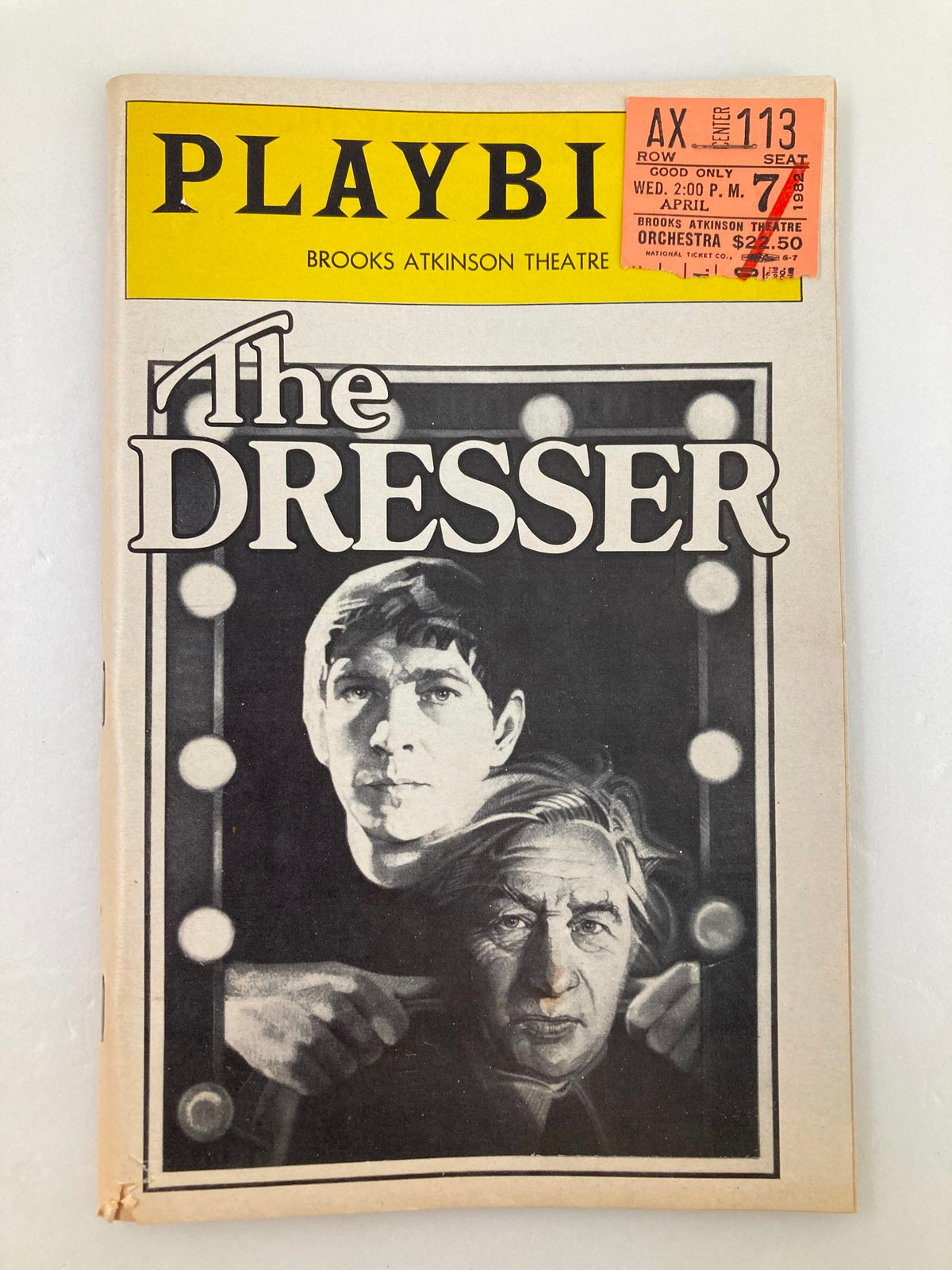 1982 Playbill for The Dresser at Brooks Atkinson Theatre featuring Tom Courtenay and Paul Roger, showcasing the cover art with theater lights.