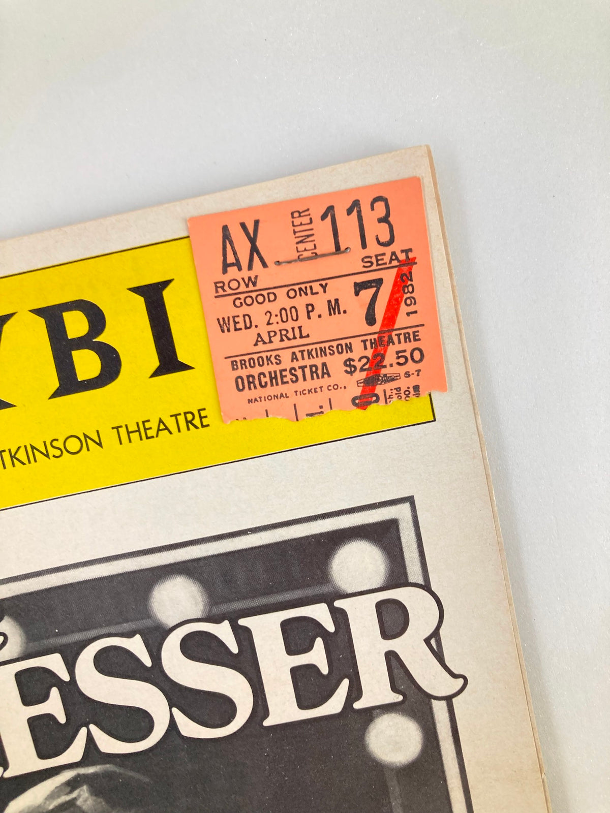 Close-up of the attached ticket from the 1982 Playbill for The Dresser, indicating seat and performance details at Brooks Atkinson Theatre.