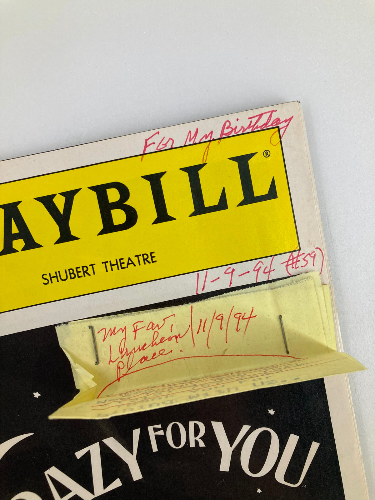 Close-up of the top section of the 1994 Playbill for Crazy for You featuring handwritten birthday dedication and date.