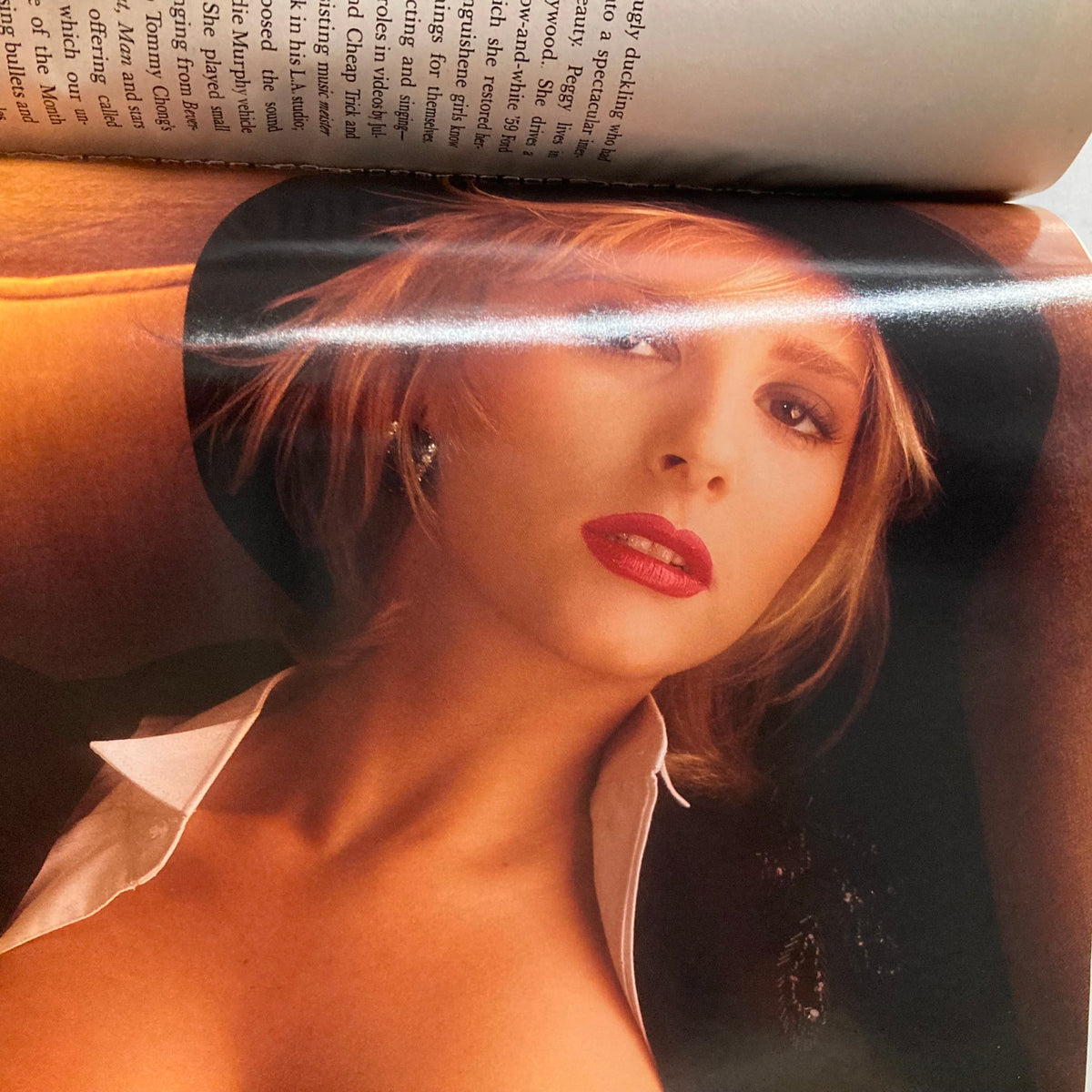 Inside page of VTG Playboy Magazine January 1990 featuring a sultry pictorial with a stunning model wearing a hat and seductive attire.