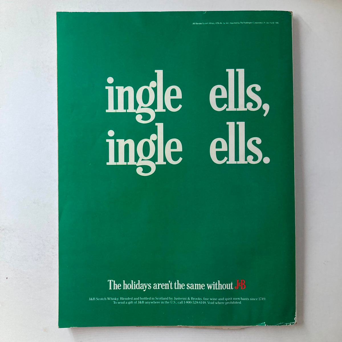 Back cover of VTG Playboy Magazine January 1990 with a minimalist green design featuring text about the holidays, maintaining the retro aesthetic of the publication.