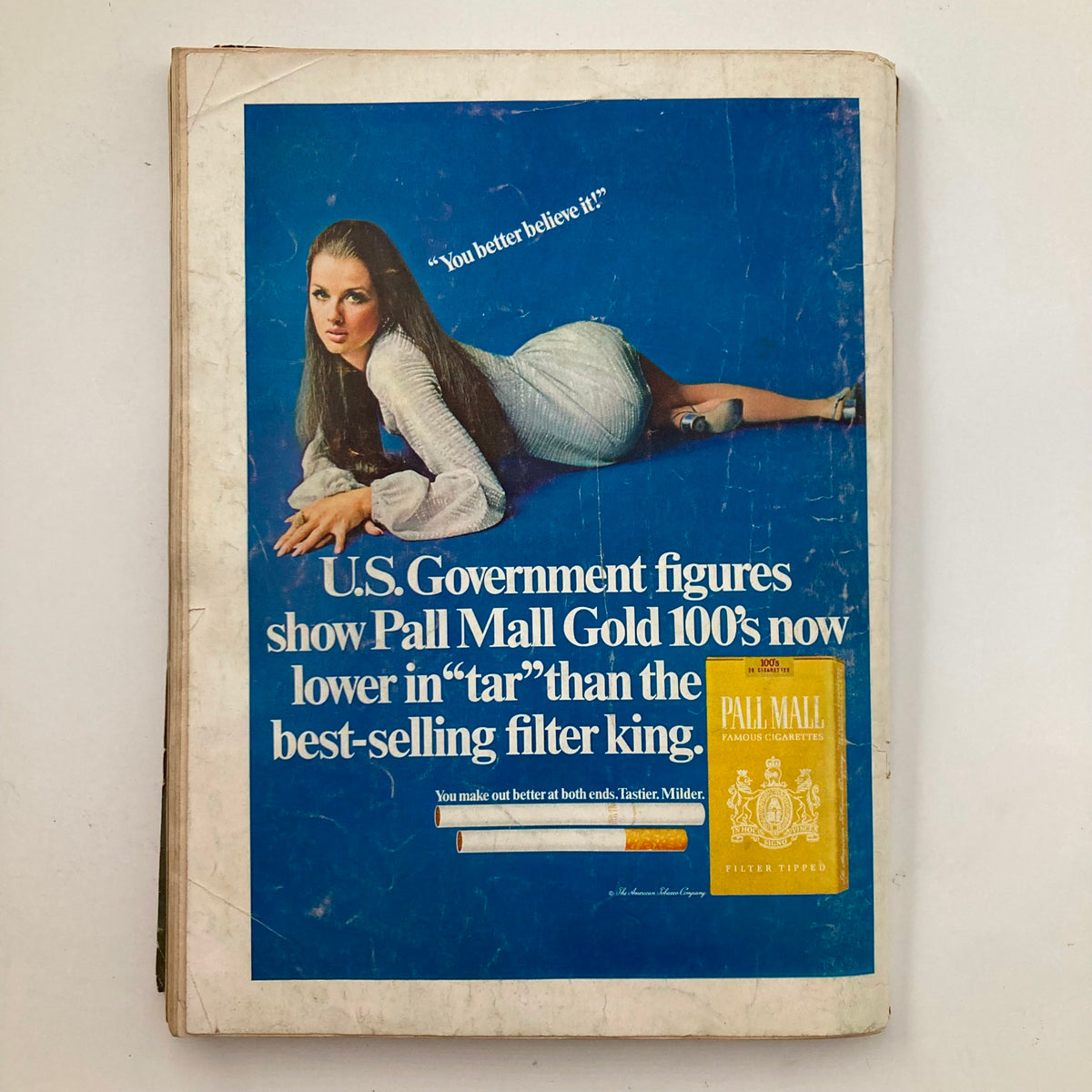 Back cover of the VTG Playboy Magazine October 1969 showcasing a vintage advertisement for Pall Mall Gold cigarettes with a model in a stylish pose.