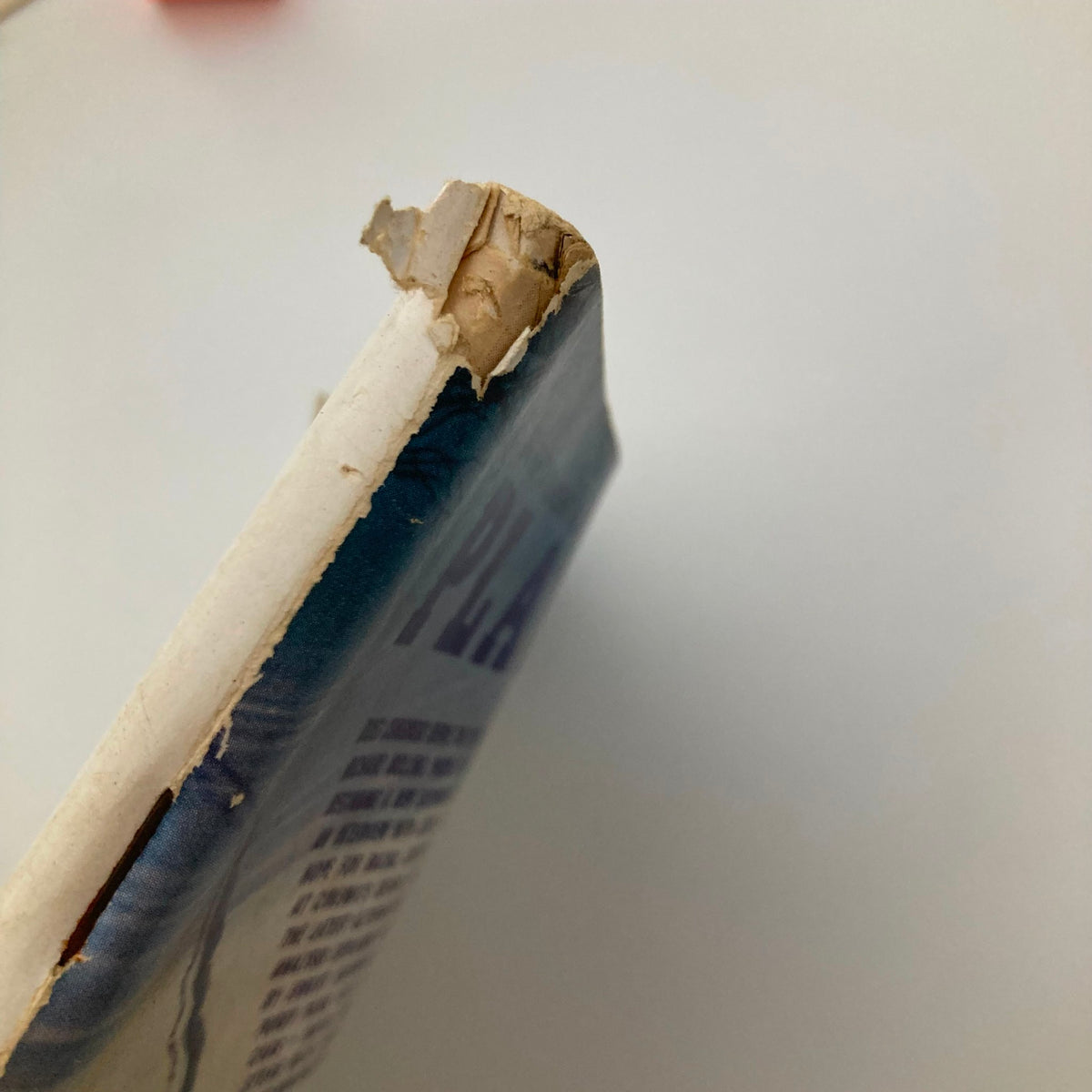 Spine view of Playboy Magazine November 1969 displaying signs of wear, including damage on the top edge, indicative of its vintage age.