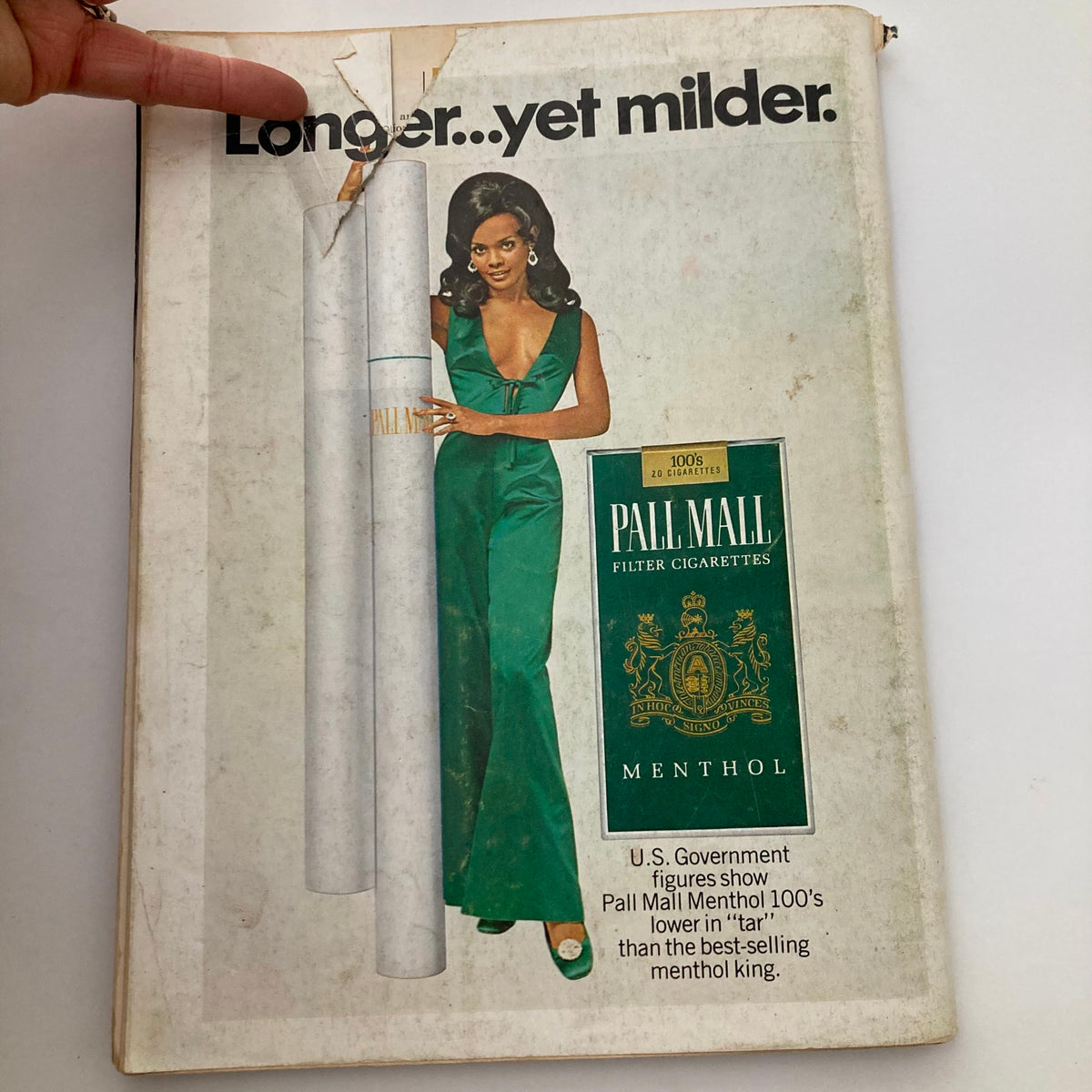 Advert from Playboy Magazine November 1969 featuring a glamorous model posing with Pall Mall cigarettes, emphasizing retro aesthetics.
