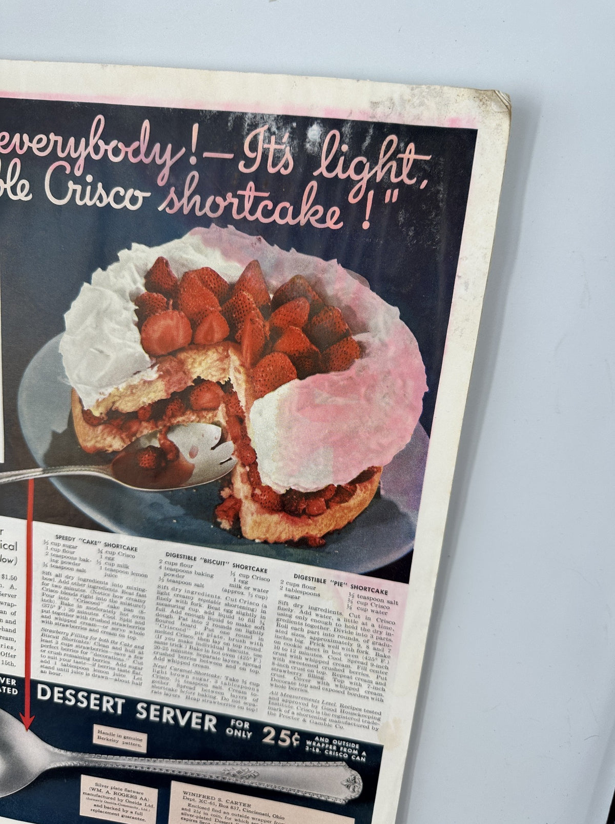 Advertisement for Crisco shortcake in Woman’s Home Companion Magazine June 1935. Features an enticing image of a shortcake topped with strawberries, emphasizing the lightness of the dessert.