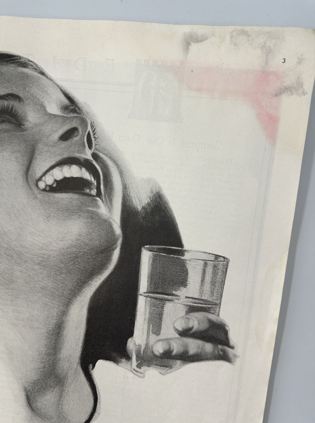 Close-up of a smiling woman holding a glass of water, from the November 1932 issue of Woman’s Home Companion Magazine, promoting Listerine as an antiseptic.